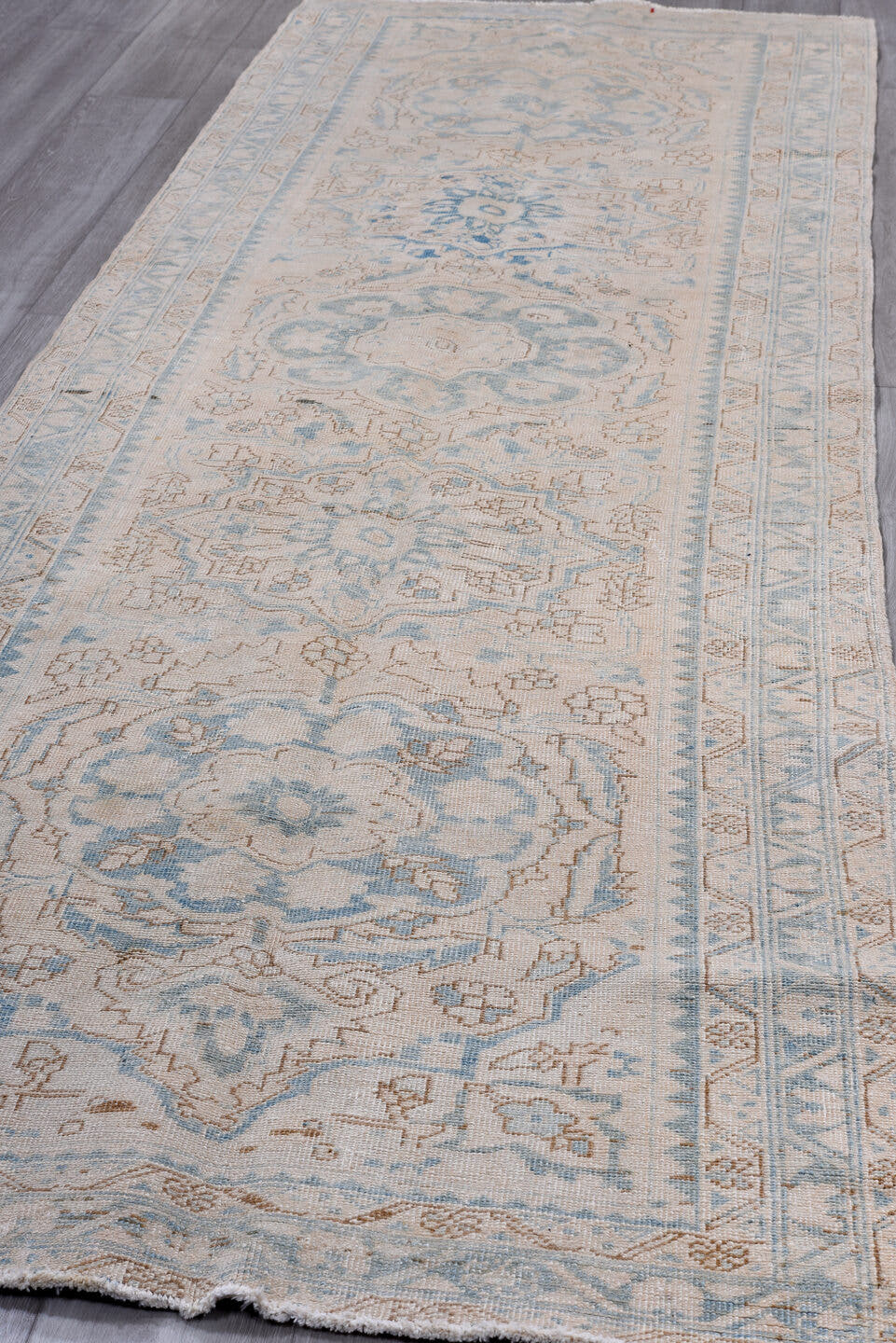 3' x 10' one-of-a-kind handmade antique Heriz runner rug. Color palette: ivory, sky blue, light blue, taupe, beige, gray