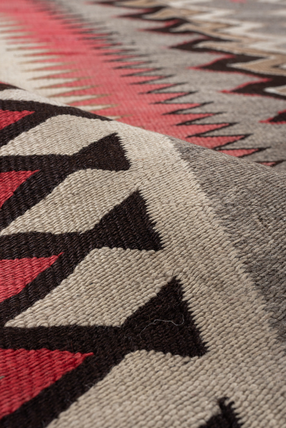 4' x 7' one-of-a-kind handmade vintage Navajo rug. Color palette: ivory, rust, taupe, charcoal, black, camel, terracotta