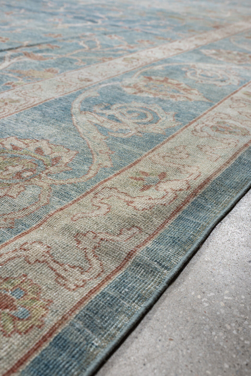 15' x 17' one-of-a-kind handmade antique Laristan oversize rug. Color palette: pale blue, ivory, blush, sage, taupe