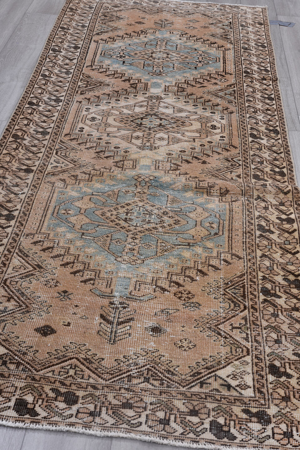 3' x 11' one-of-a-kind handmade antique Heriz runner rug. Color palette: camel, ivory, sky blue, taupe, charcoal, brown
