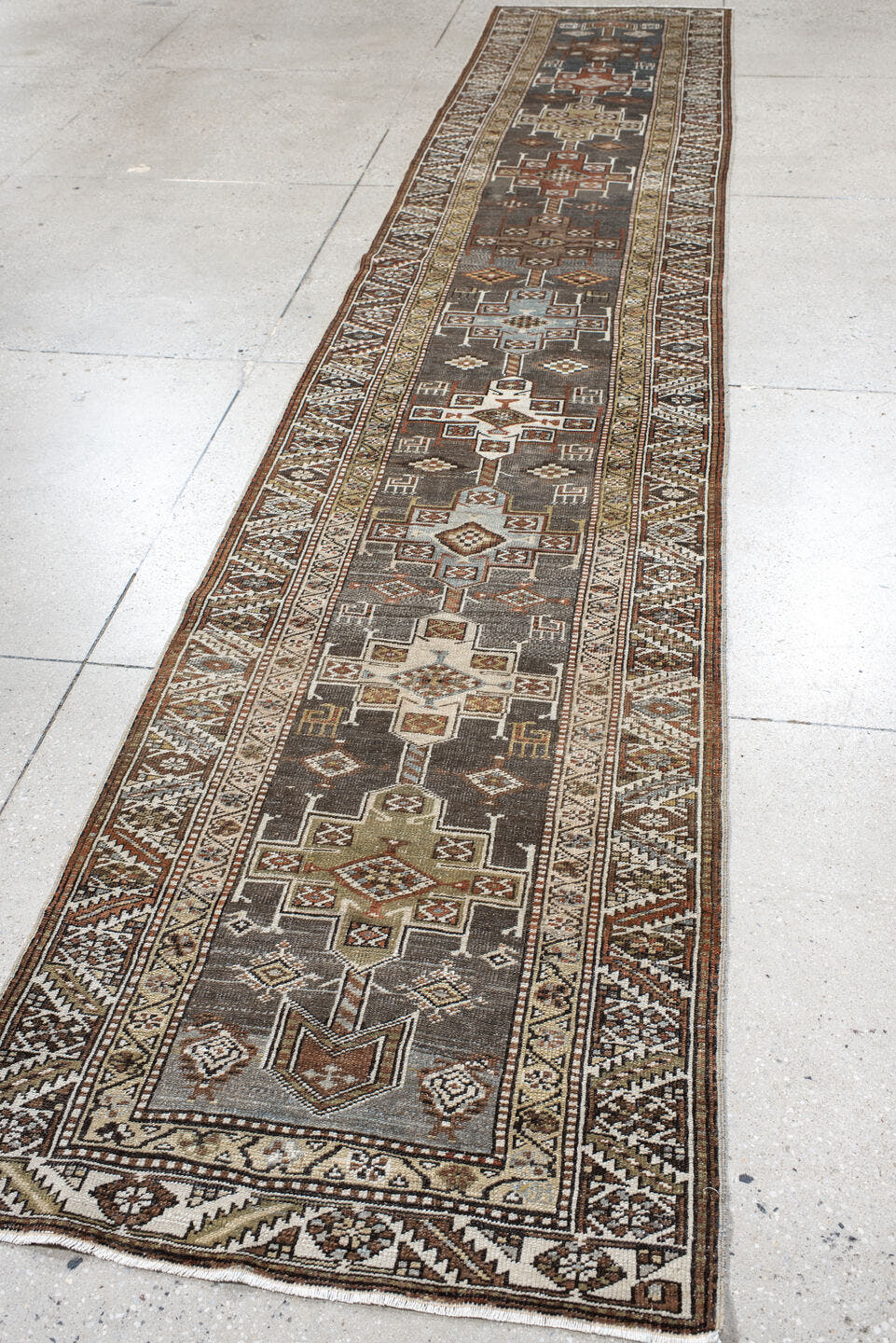 2' x 14' one-of-a-kind handmade antique Heriz runner rug. Color palette: taupe, brown, ivory, rust, camel, charcoal, beige