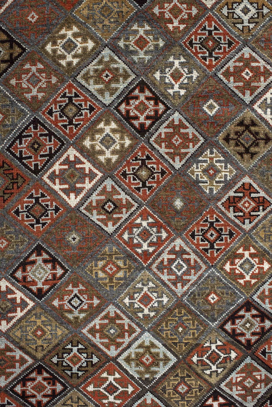 3' x 9' one-of-a-kind handmade antique Kurd runner rug. Color palette: taupe, rust, ivory, brown, charcoal, camel, burgundy
