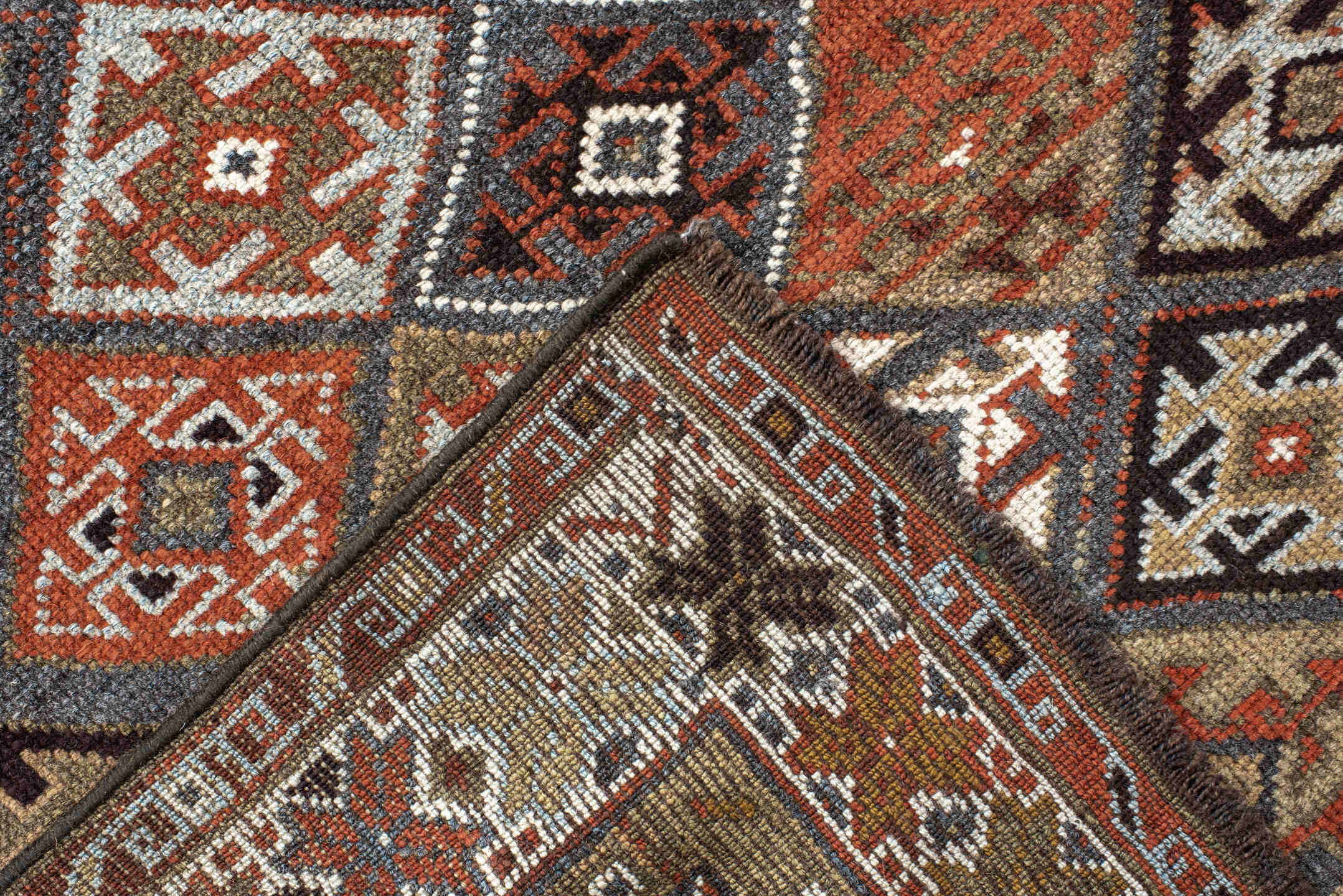3' x 9' one-of-a-kind handmade antique Kurd runner rug. Color palette: taupe, rust, ivory, brown, charcoal, camel, burgundy