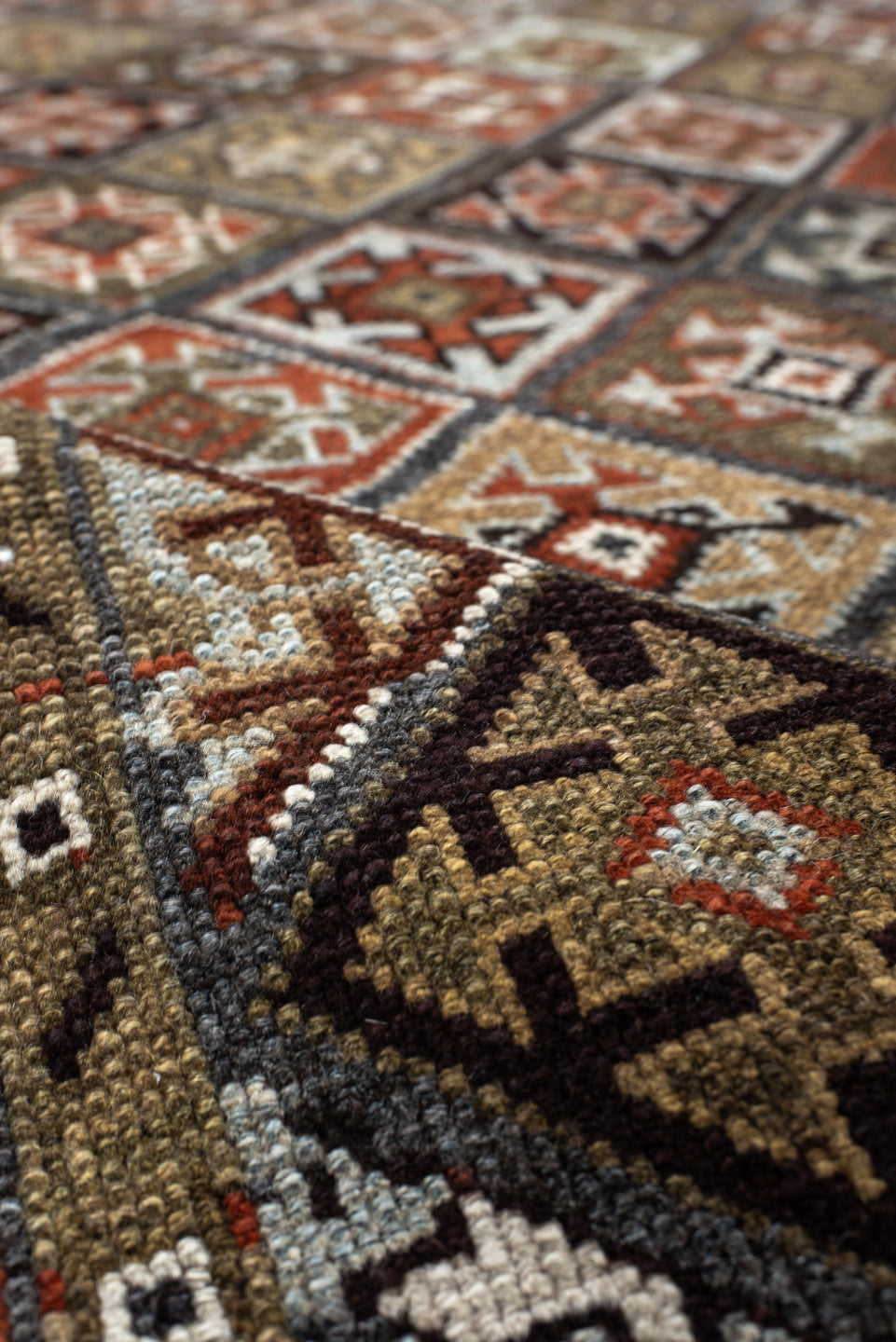 3' x 9' one-of-a-kind handmade antique Kurd runner rug. Color palette: taupe, rust, ivory, brown, charcoal, camel, burgundy