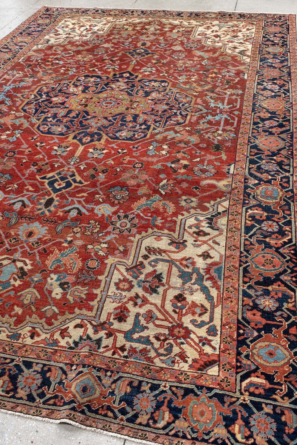 7' x 11' one-of-a-kind handmade antique Heriz large size rug. Color palette: rust, navy, ivory, light_blue, rose, camel