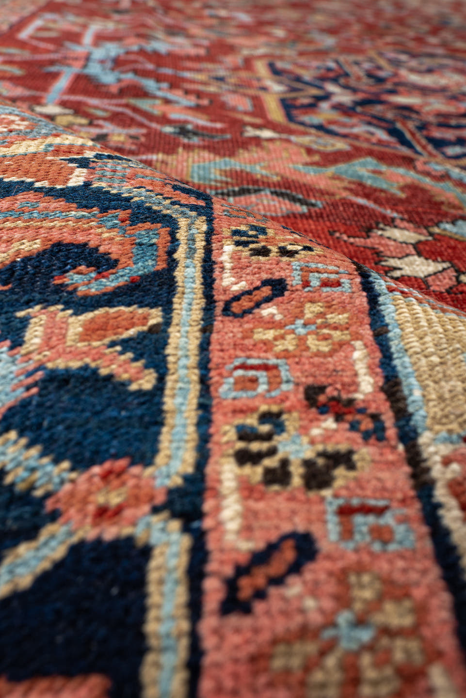 7' x 11' one-of-a-kind handmade antique Heriz large size rug. Color palette: rust, navy, ivory, light_blue, rose, camel