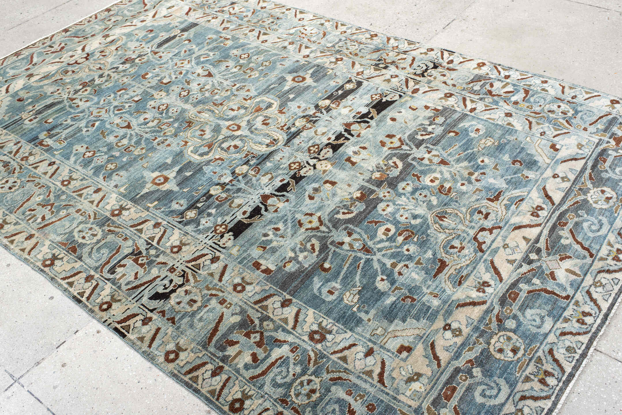 6' x 9' one-of-a-kind handmade vintage Lilian medium size rug. Color palette: black, blue, brown, charcoal, dark gray