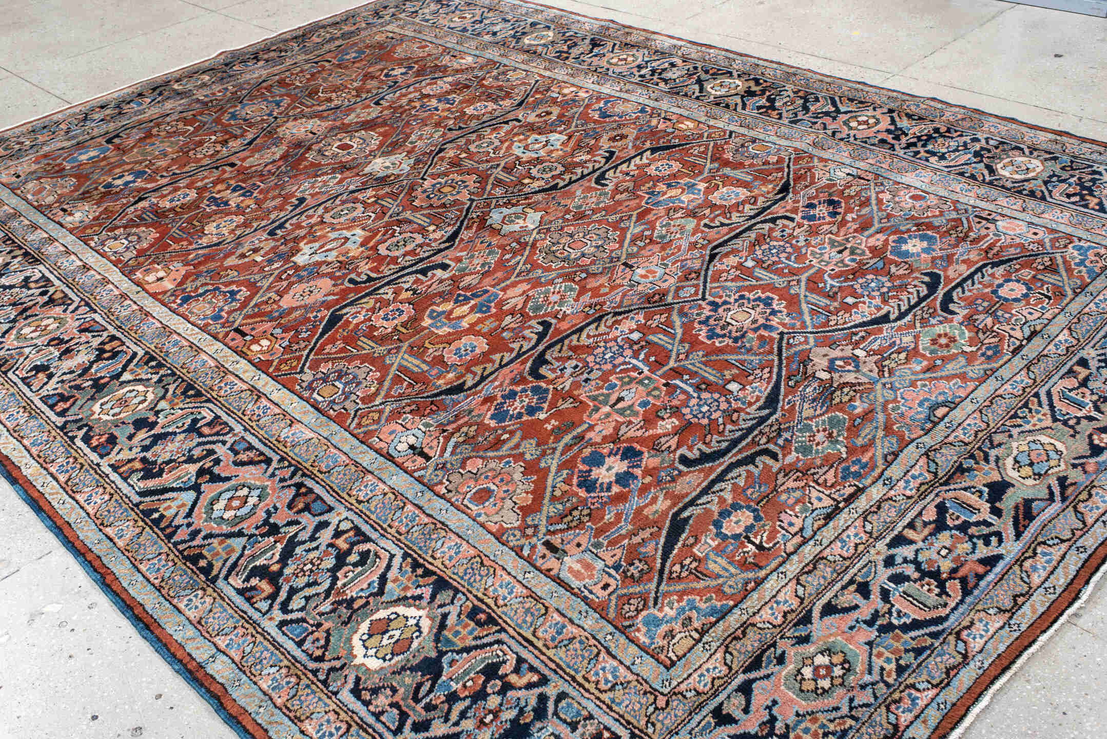9' x 12' one-of-a-kind handmade antique Heriz large size rug. Color palette: rust, navy, ivory, sky_blue, camel, slate