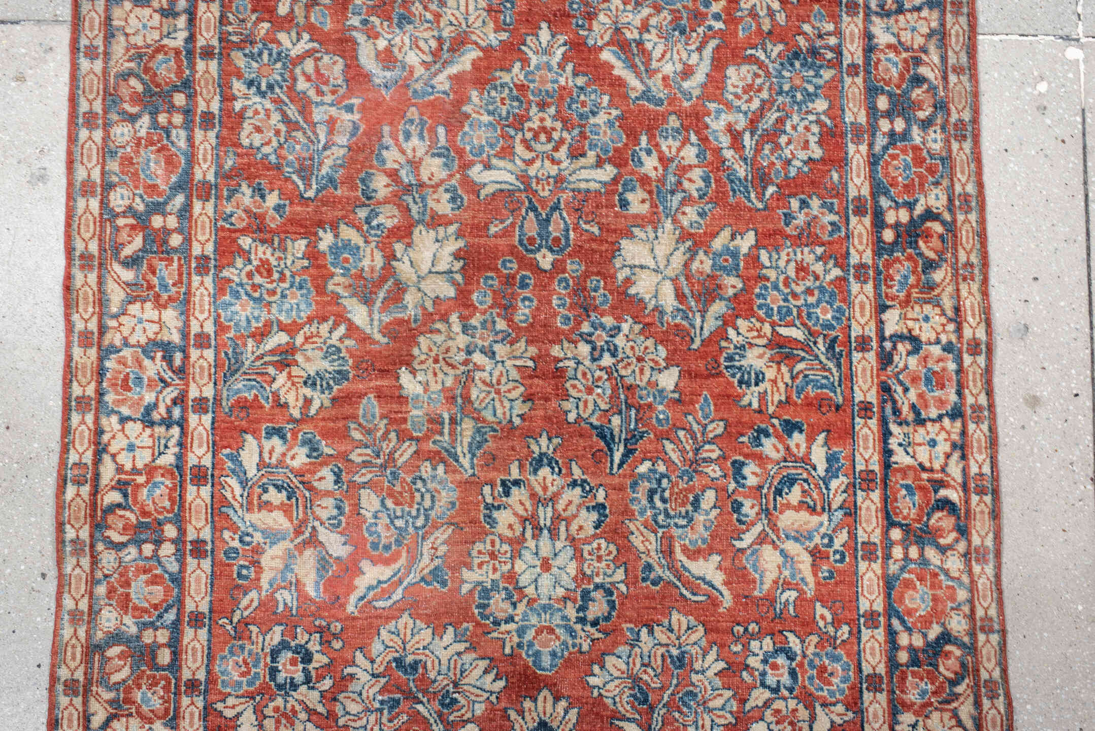 3' x 11' one-of-a-kind handmade antique Sarouk runner rug. Color palette: rust, ivory, blue, navy, cream, terra cotta