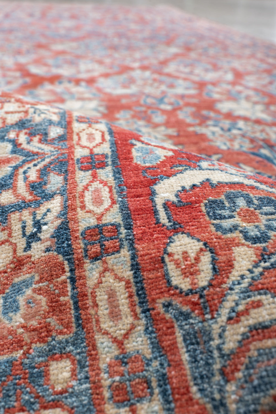 3' x 11' one-of-a-kind handmade antique Sarouk runner rug. Color palette: rust, ivory, blue, navy, cream, terra cotta