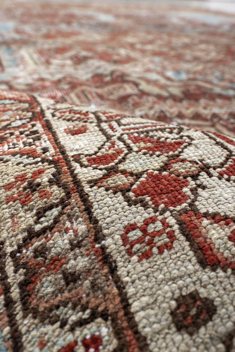 7' x 11' one-of-a-kind handmade antique Heriz large size rug. Color palette: ivory, rust, sky_blue, terra_cotta, taupe