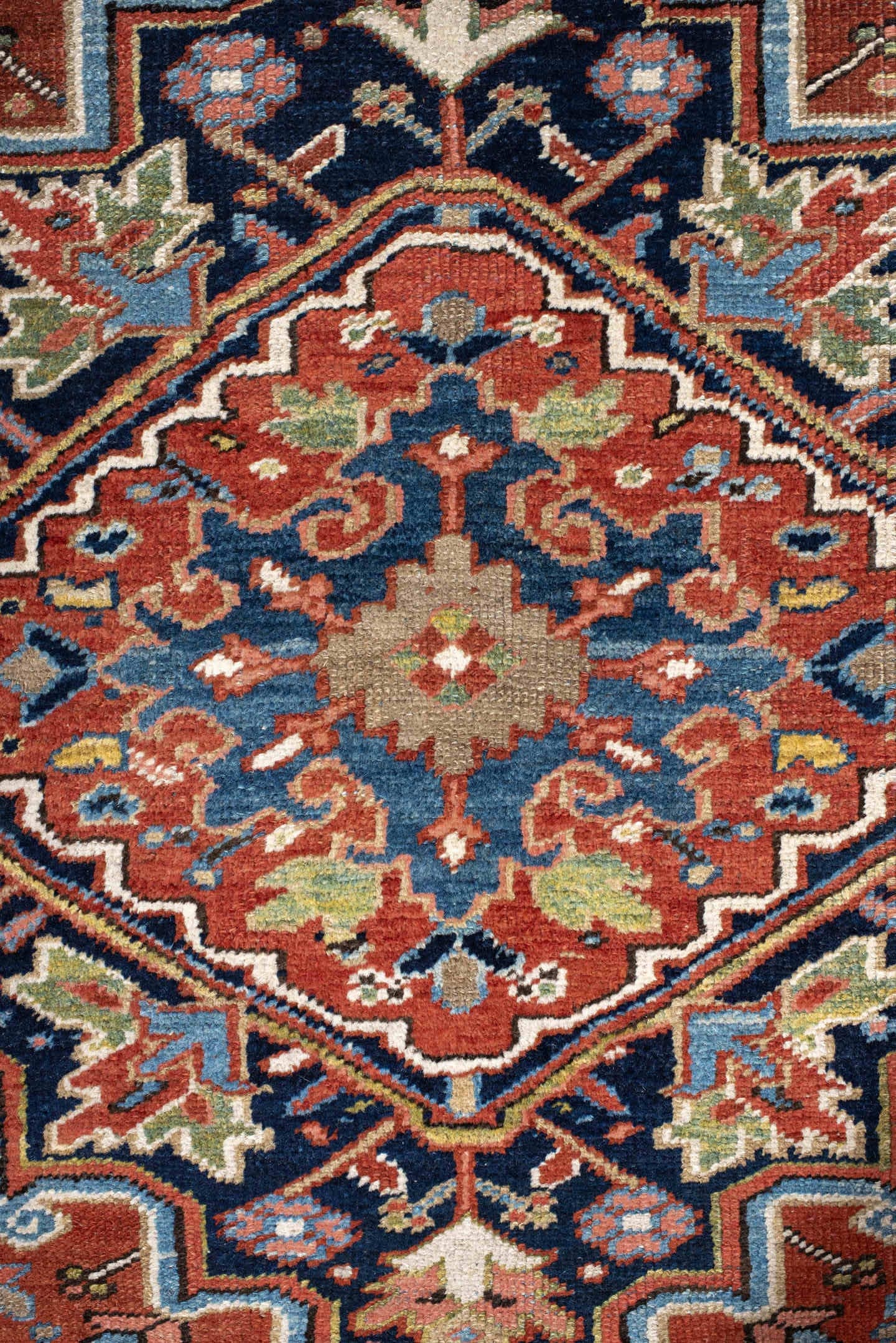 7' x 11' one-of-a-kind handmade antique Heriz large size rug. Color palette: rust, navy, ivory, sky blue, terra cotta, camel