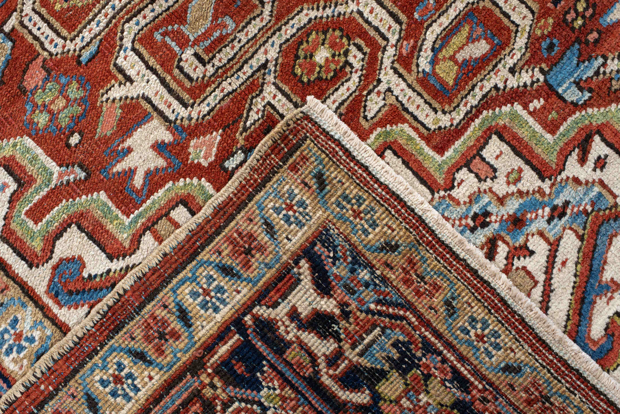7' x 11' one-of-a-kind handmade antique Heriz large size rug. Color palette: rust, navy, ivory, sky blue, terra cotta, camel