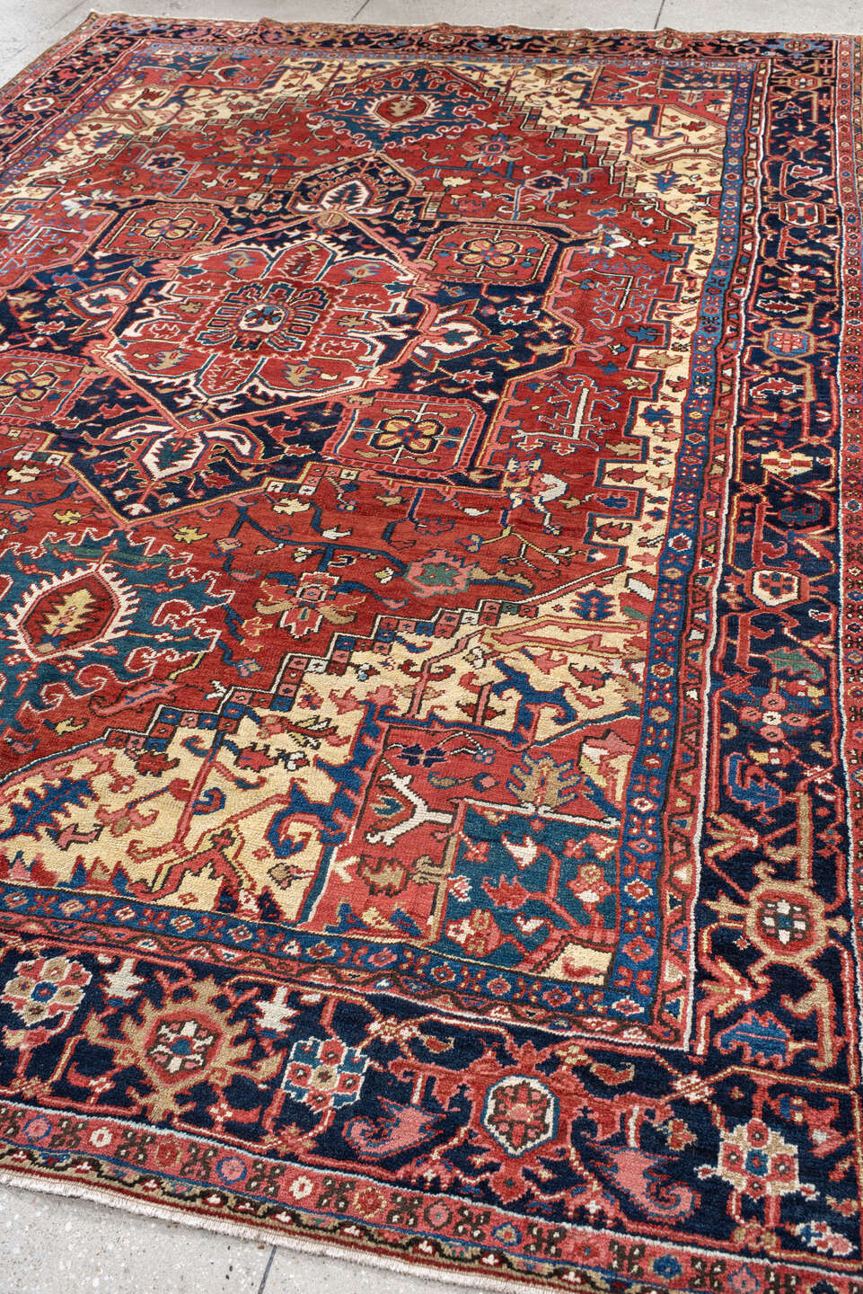 8' x 11' one-of-a-kind handmade antique Heriz large size rug. Color palette: rust, navy, ivory, sky blue, terra cotta, camel