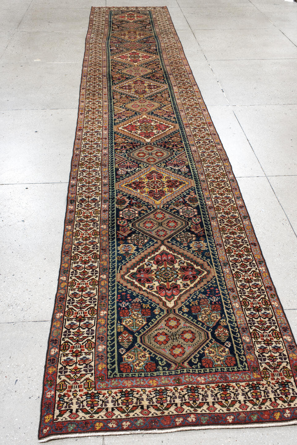2' x 17' one-of-a-kind handmade antique Malayer runner rug. Color palette: ivory, indigo, rust, camel, burgundy, navy