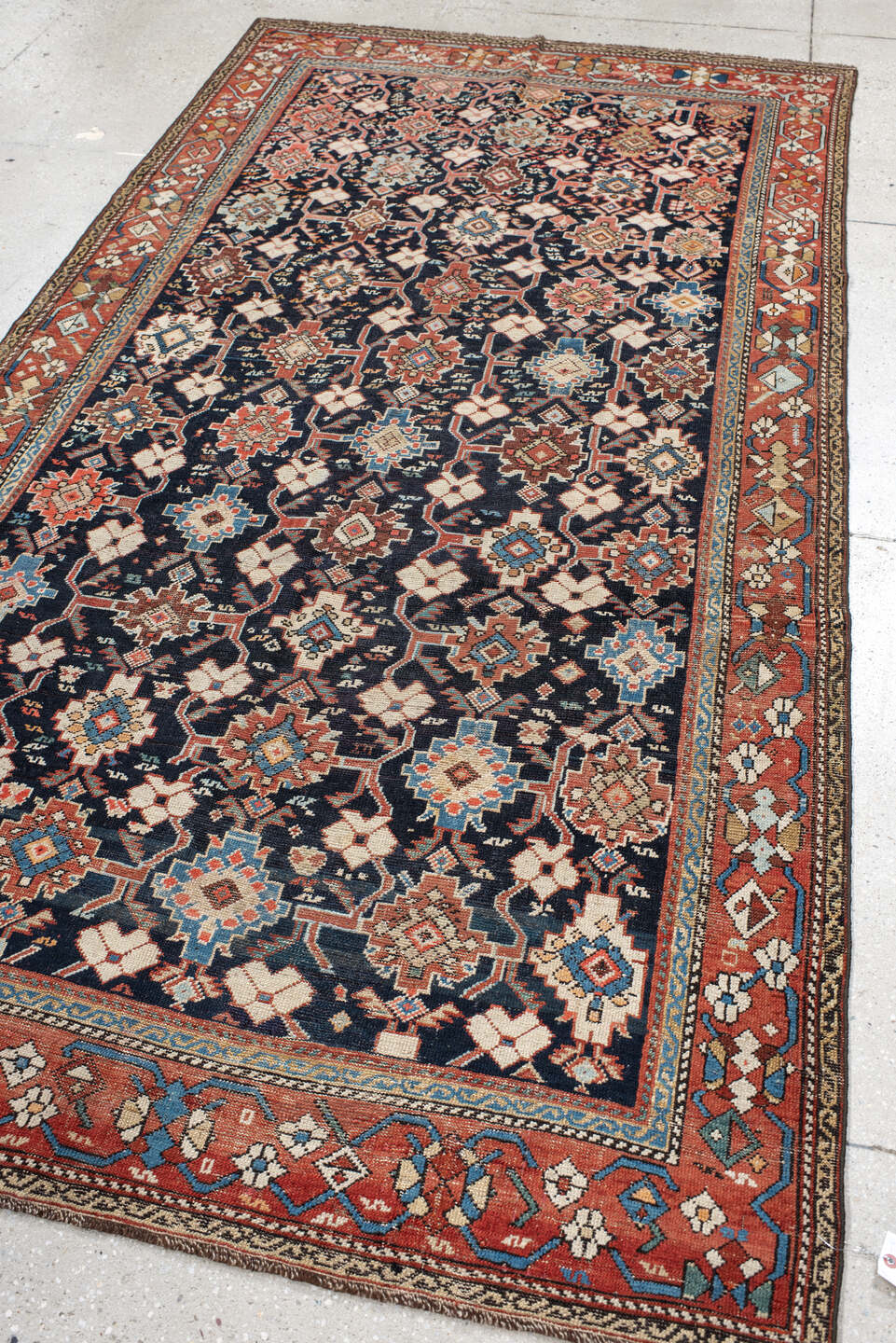 4' x 9' one-of-a-kind handmade antique Karabagh runner rug. Color palette: navy, terra cotta, ivory, light blue, rust, brown
