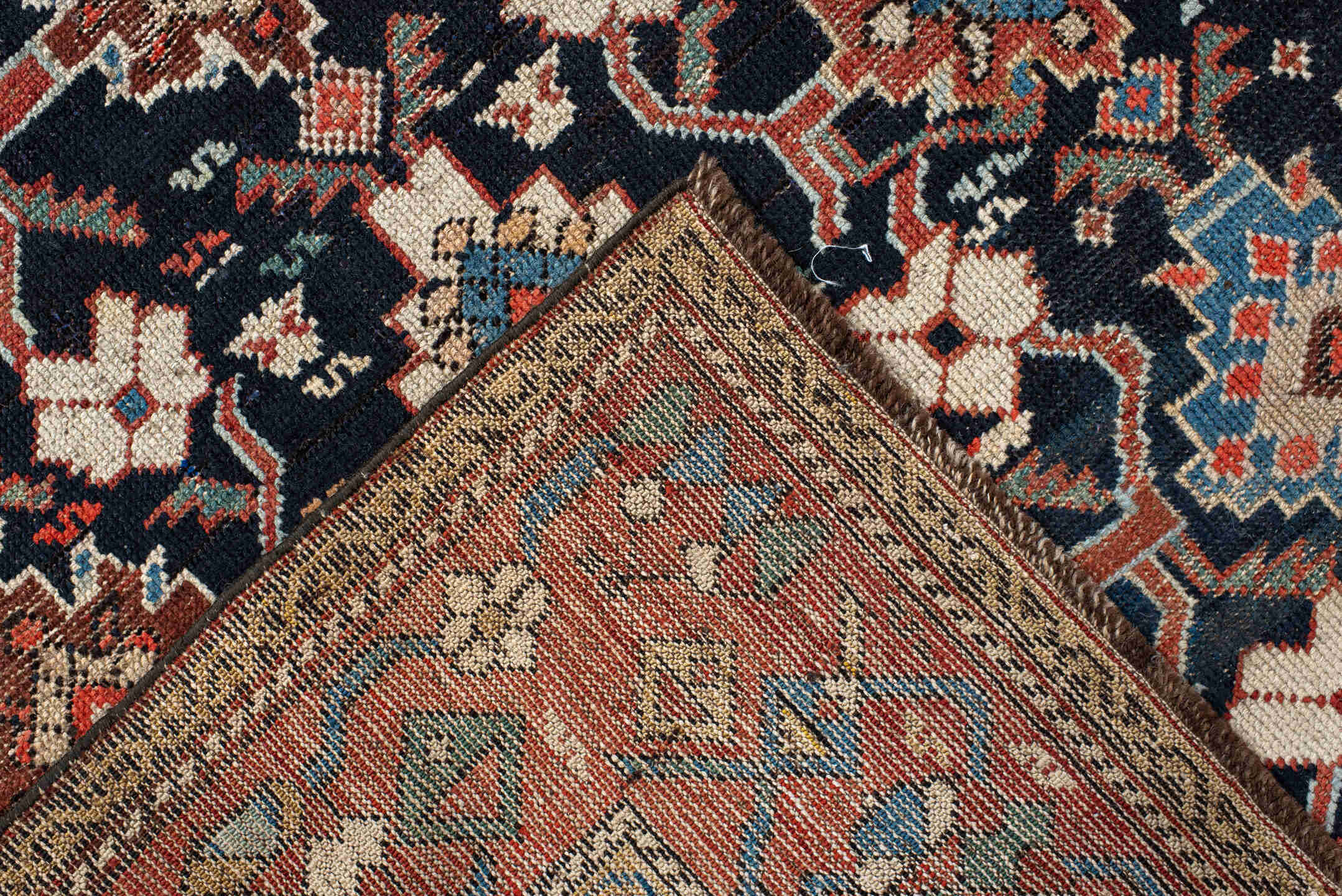 4' x 9' one-of-a-kind handmade antique Karabagh runner rug. Color palette: navy, terra cotta, ivory, light blue, rust, brown