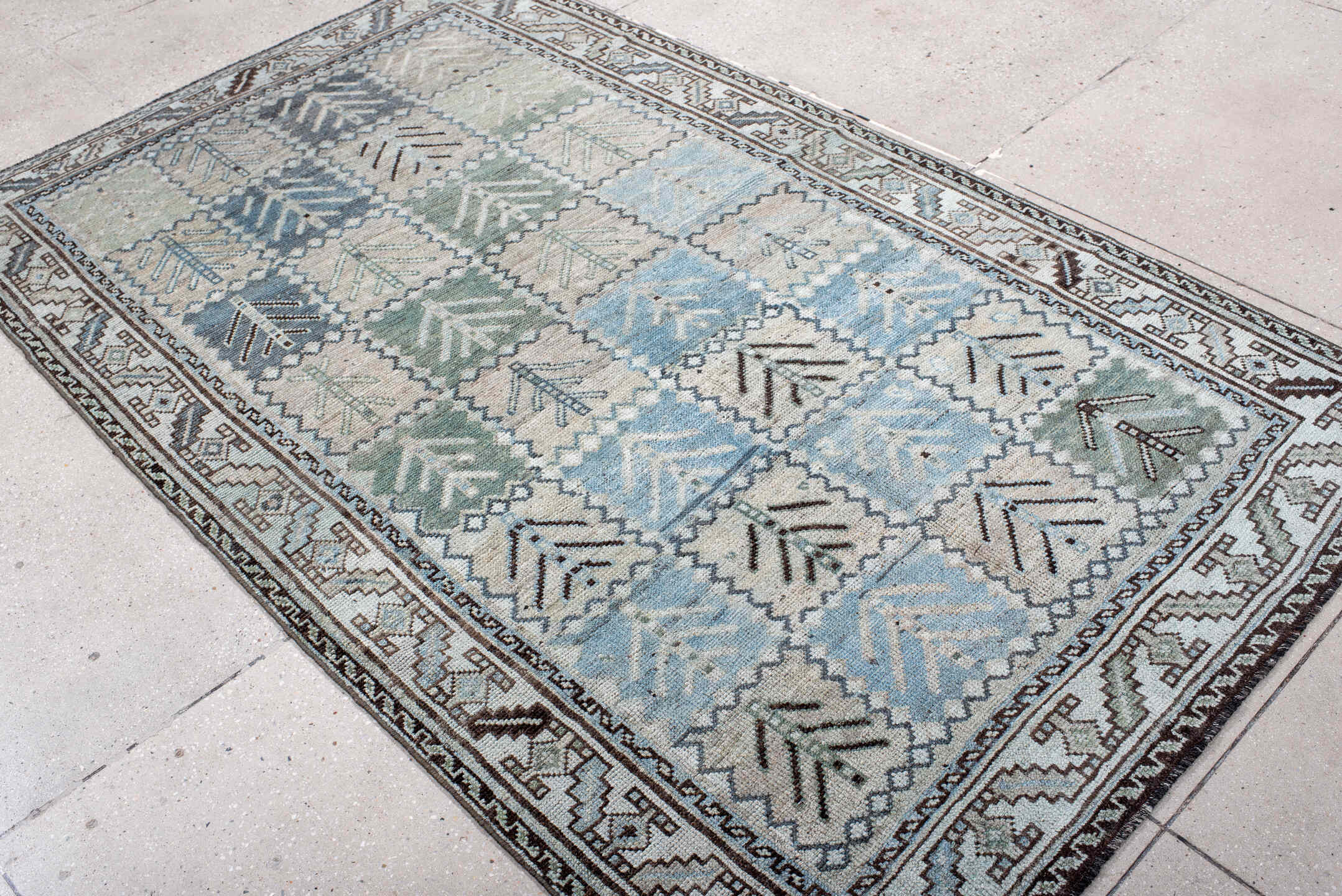 4' x 7' one-of-a-kind handmade antique Gabbe rug. Color palette: ivory, sky blue, sage, charcoal, taupe, slate, light blue
