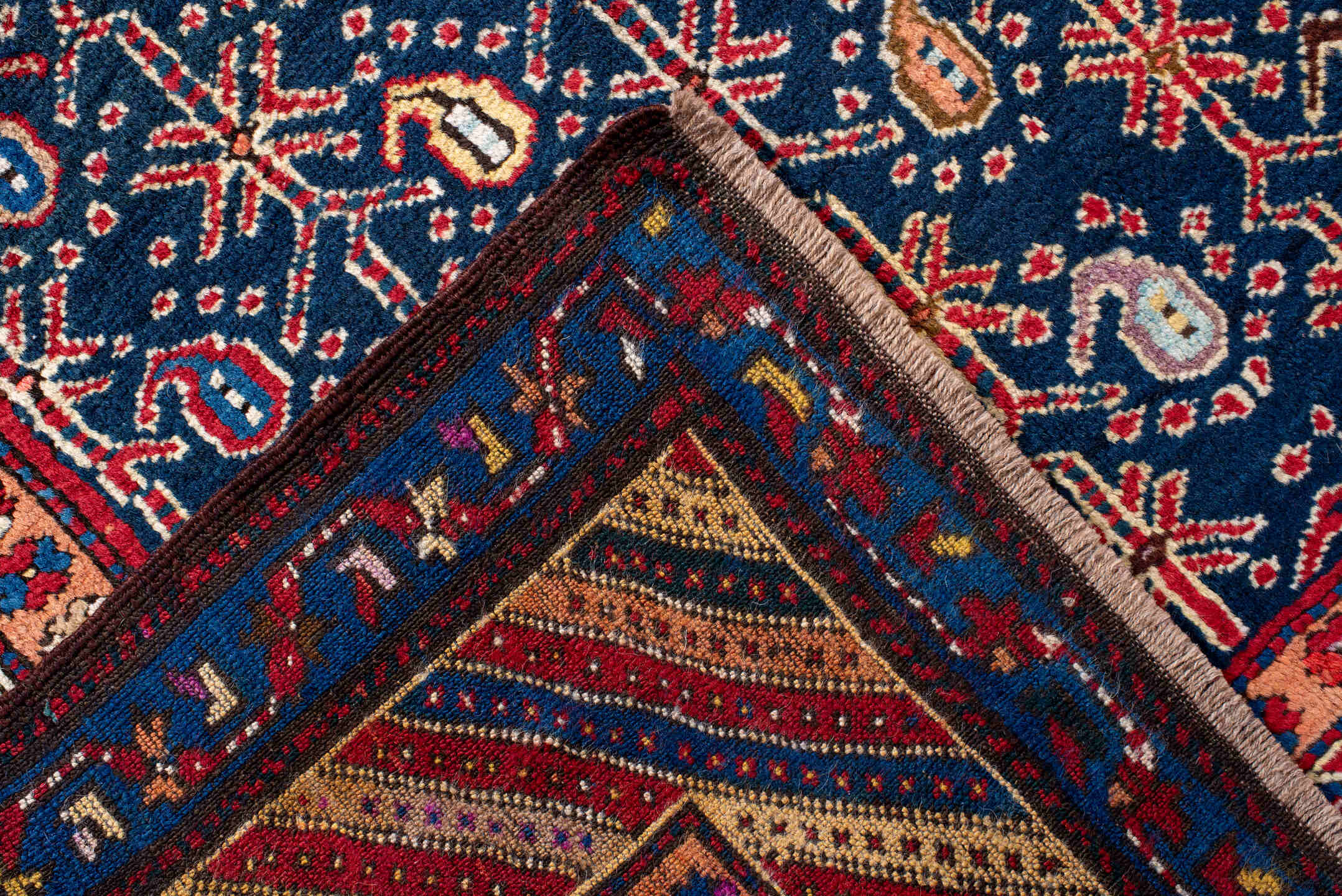 4' x 10' one-of-a-kind handmade antique NW Persian runner rug. Color palette: navy, ivory, red, cobalt, rust, camel, crimson