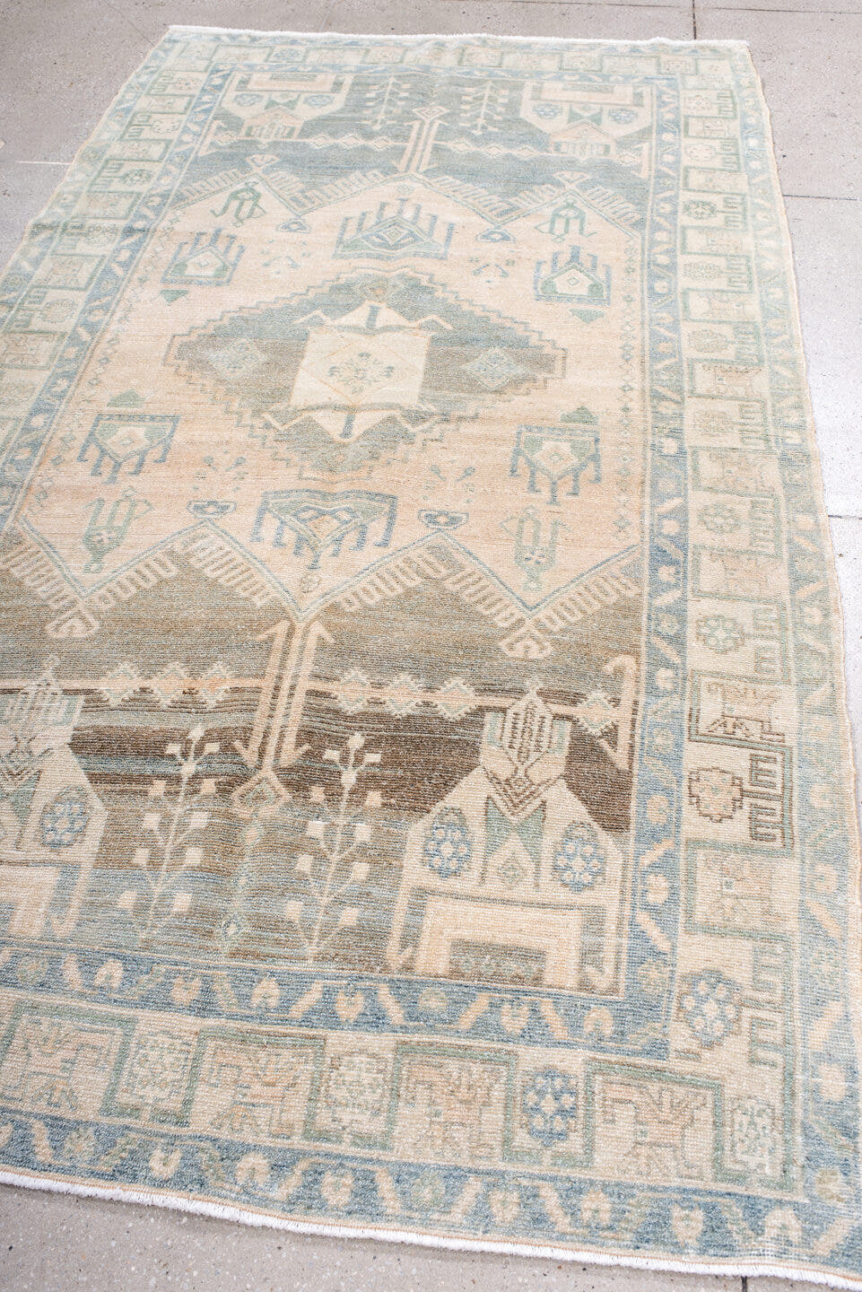 4' x 9' one-of-a-kind handmade antique Hamadan rug. Color palette: ivory, pale blue, blush, taupe, camel, sage, brown