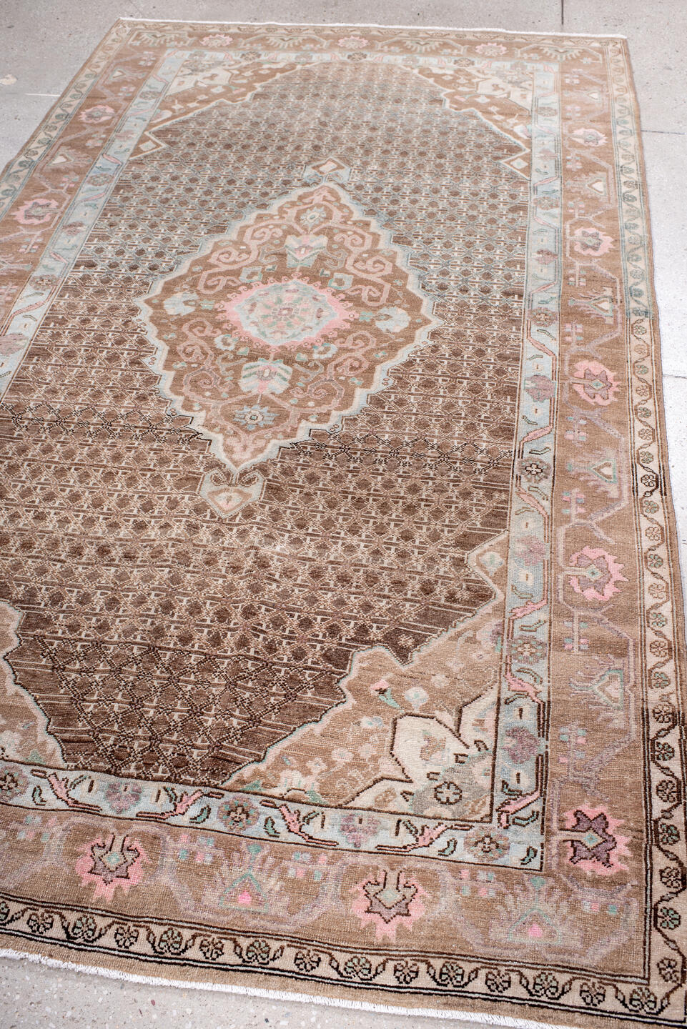 5' x 8' one-of-a-kind handmade antique Sarouk medium size rug. Color palette: taupe, brown, ivory, blush, pale blue, rose