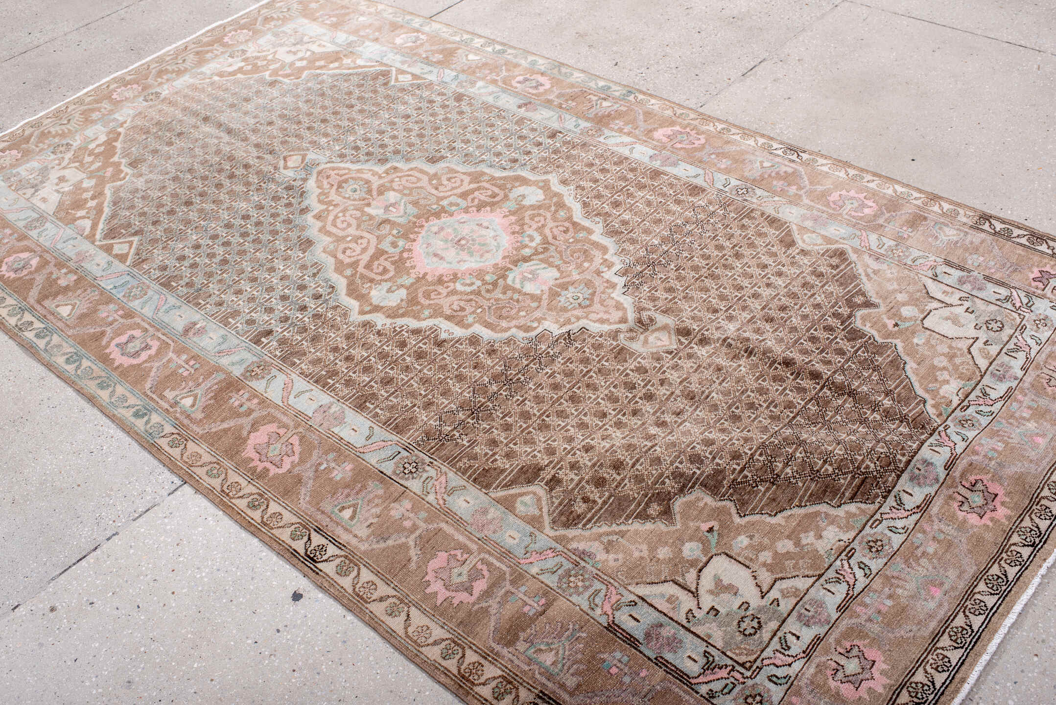 5' x 8' one-of-a-kind handmade antique Sarouk medium size rug. Color palette: taupe, brown, ivory, blush, pale blue, rose