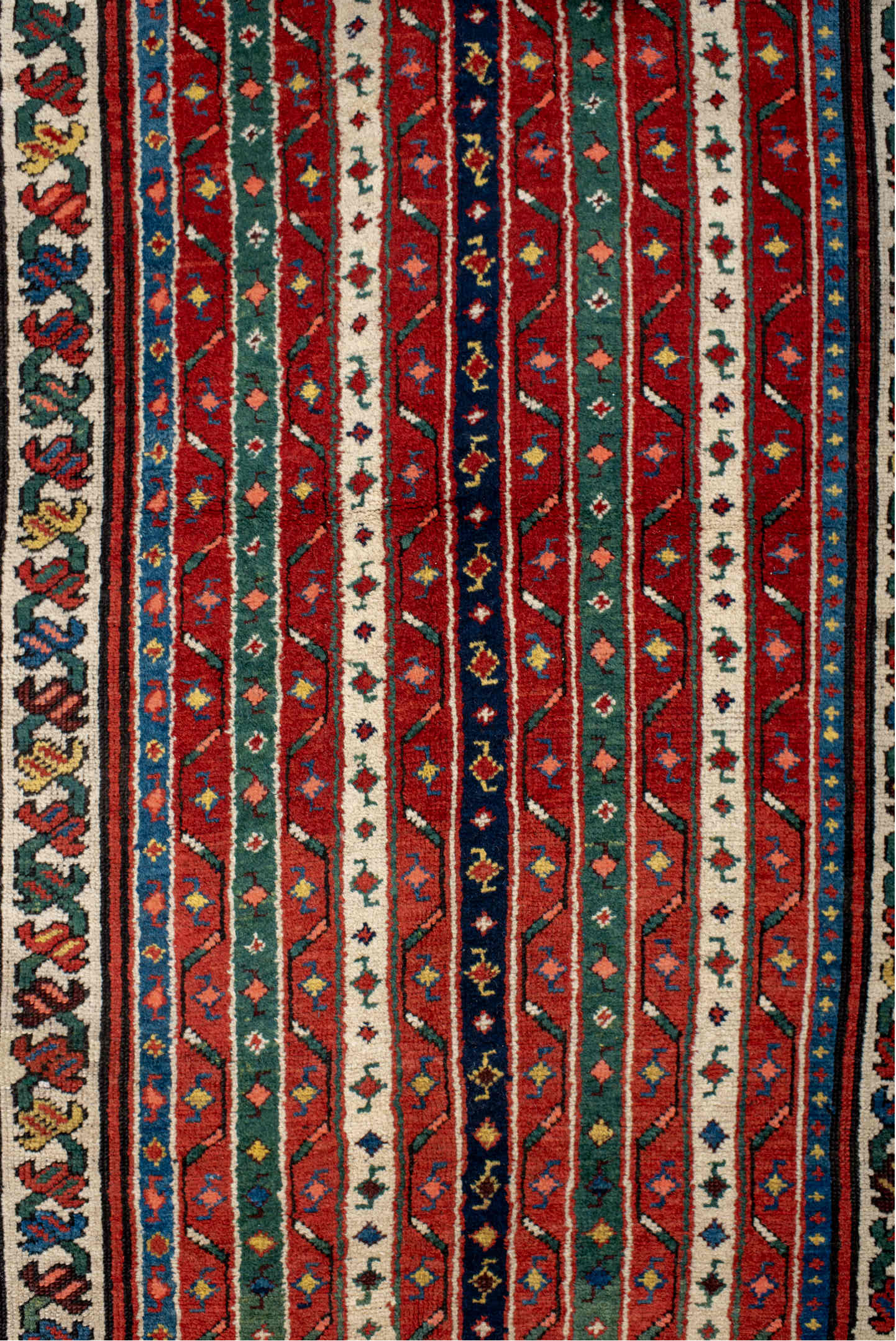 4' x 9' one-of-a-kind handmade vintage Caucasian runner rug. Color palette: antiquewhite, blue, brown, cornsilk, fiord