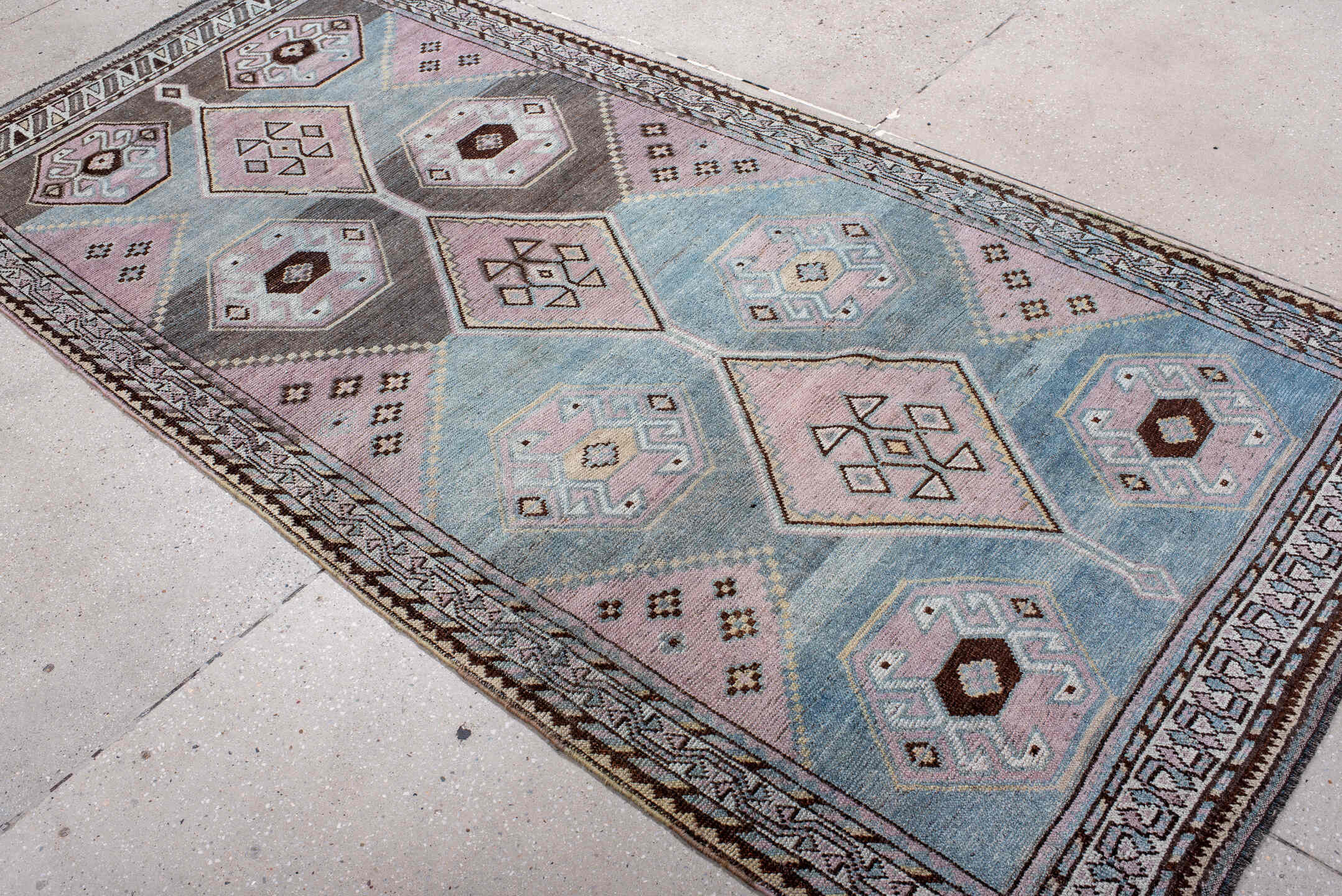 4' x 8' one-of-a-kind handmade antique Gabbe rug. Color palette: sky blue, lavender, charcoal, ivory, brown, blush, taupe