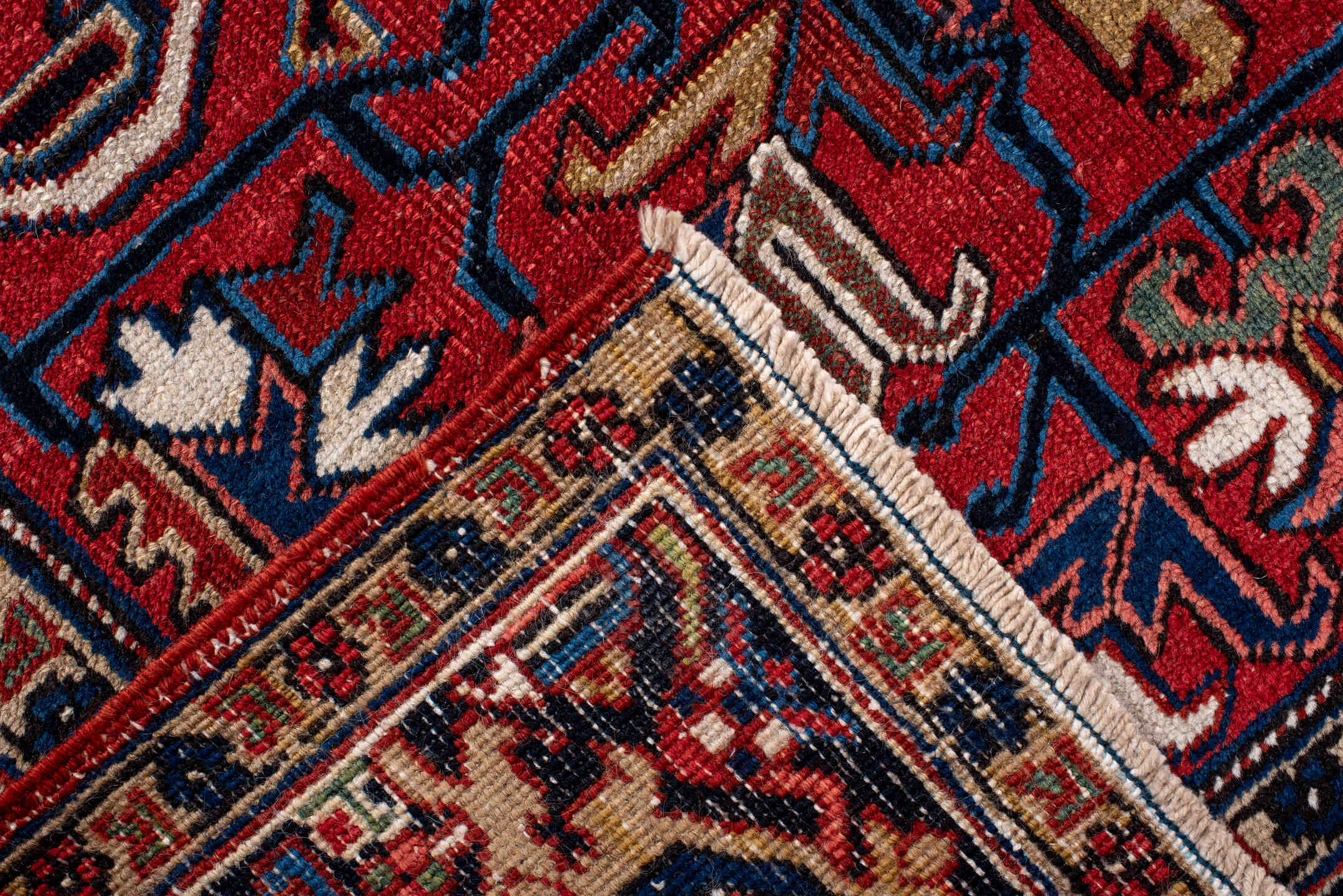 7' x 10' one-of-a-kind handmade antique Heriz large size rug. Color palette: red, navy, ivory, sky blue, camel, rust, brown