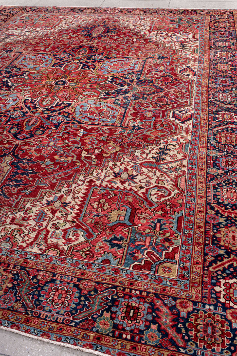 10' x 14' one-of-a-kind handmade antique Heriz large size rug. Color palette: rust, navy, ivory, sky_blue, crimson, coral