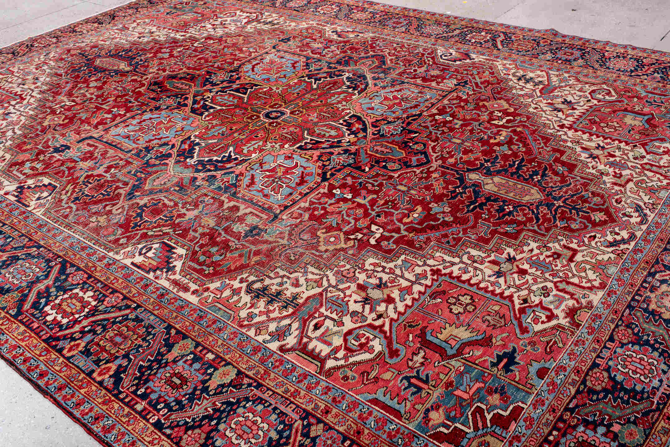 10' x 14' one-of-a-kind handmade antique Heriz large size rug. Color palette: rust, navy, ivory, sky_blue, crimson, coral