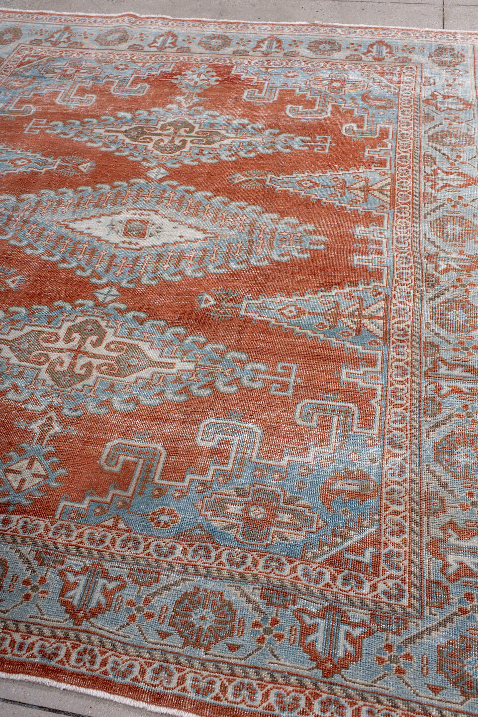 7' x 8' one-of-a-kind handmade antique Veece rug. Color palette: rust, pale blue, ivory, taupe, camel, terracotta, brown