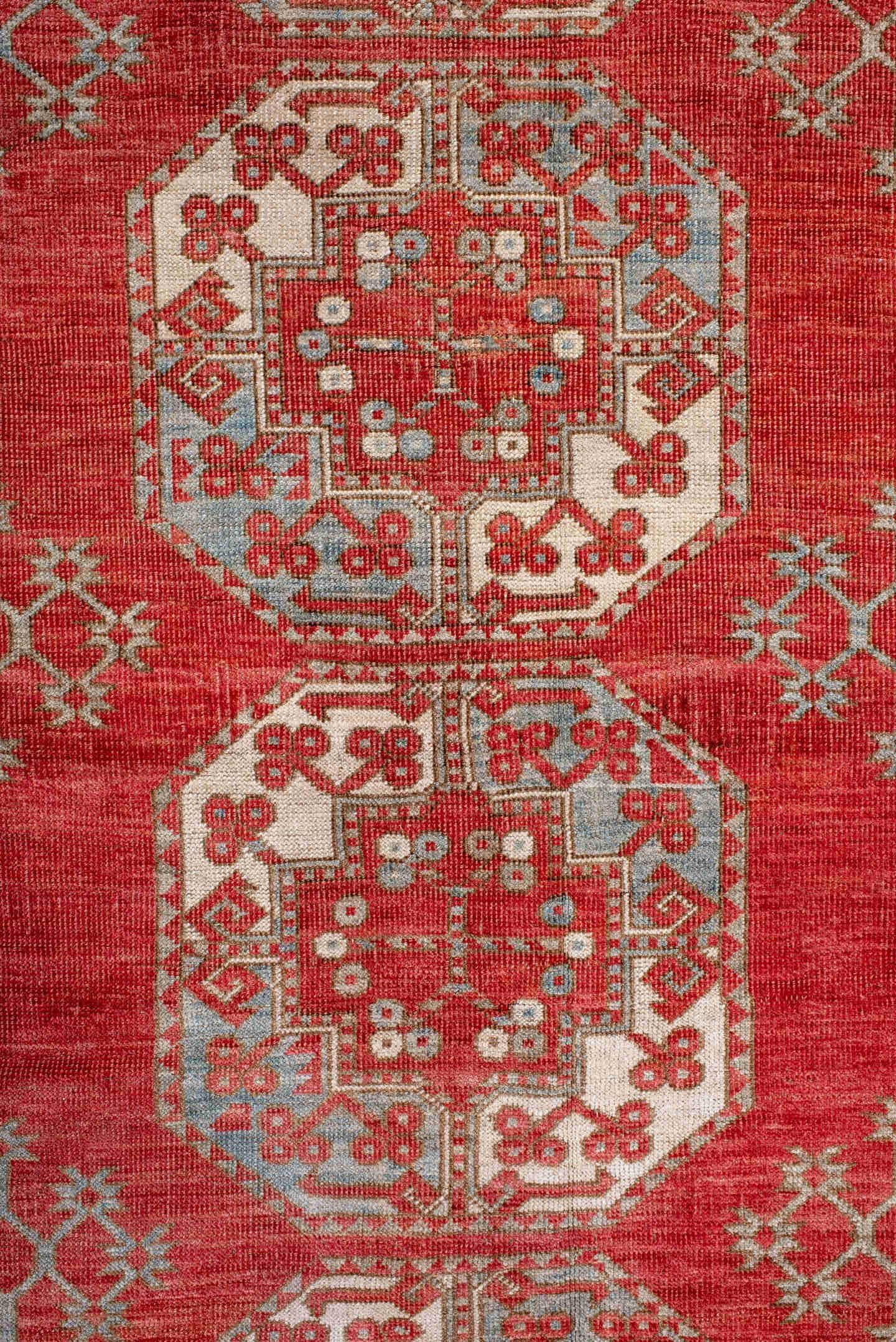 7' x 9' one-of-a-kind handmade antique Afghan rug. Color palette: red, ivory, rust, sky_blue, salmon, terracotta, brown