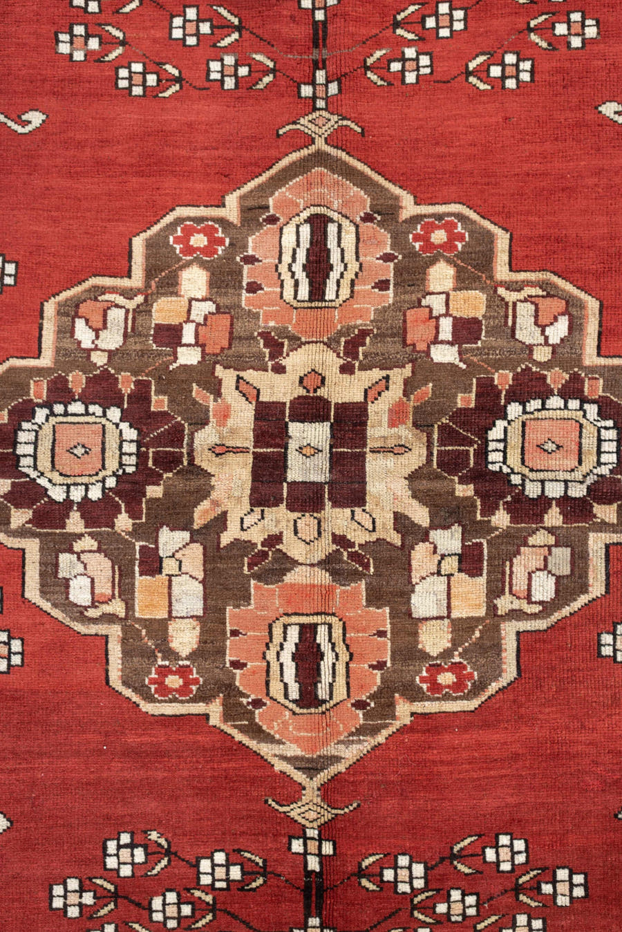 5' x 6' one-of-a-kind handmade antique Caucasian rug. Color palette: terracotta, ivory, taupe, brown, rose, mahogany, camel