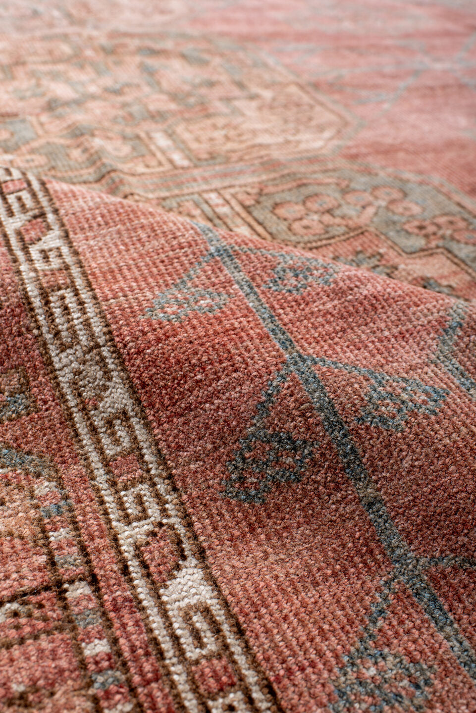 8' x 11' one-of-a-kind handmade vintage Afghan large size rug. Color palette: brown, gray, off-white, orange, pink