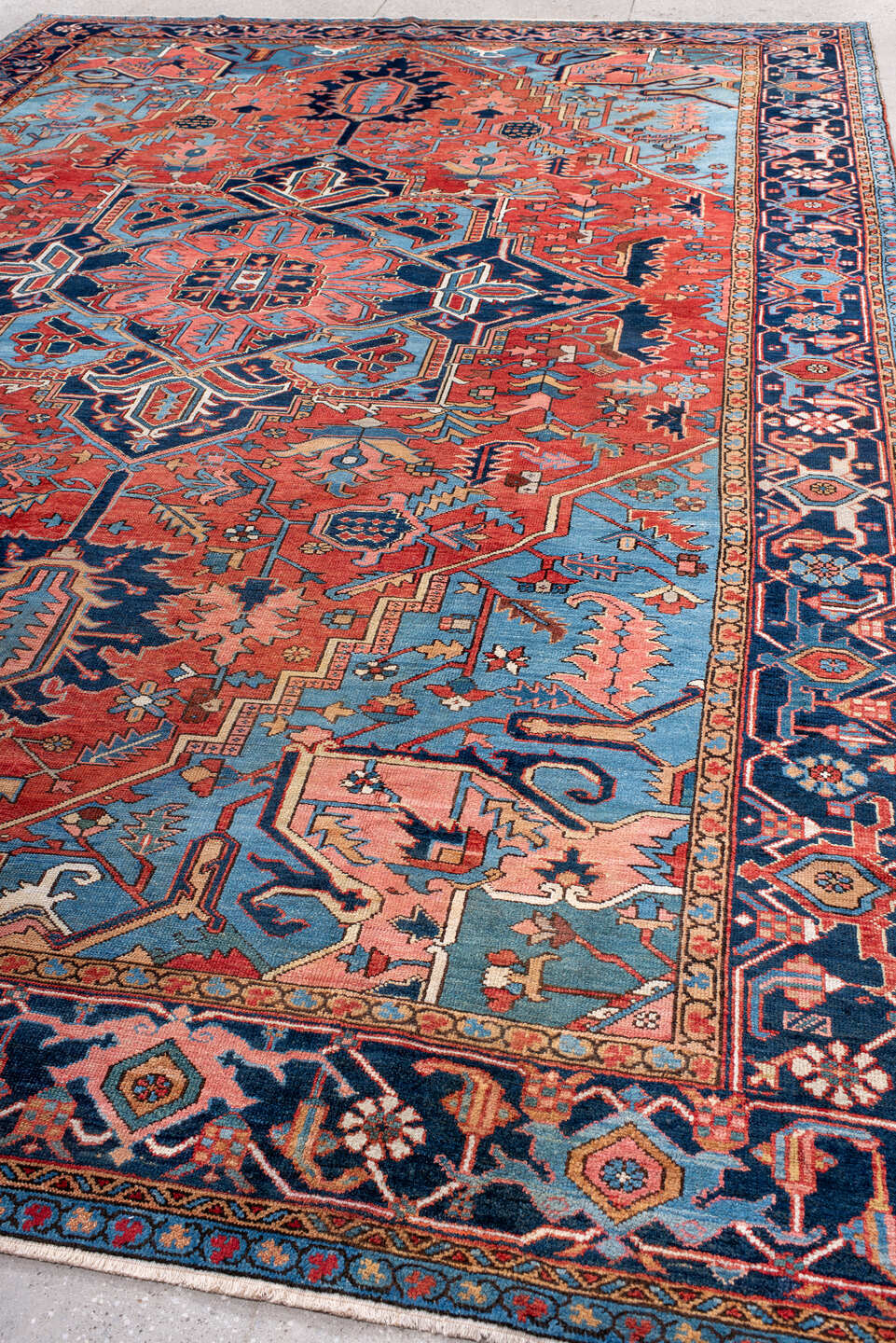 10' x 14' one-of-a-kind handmade antique Serapi large size rug. Color palette: rust, sky blue, navy, coral, ivory, slate
