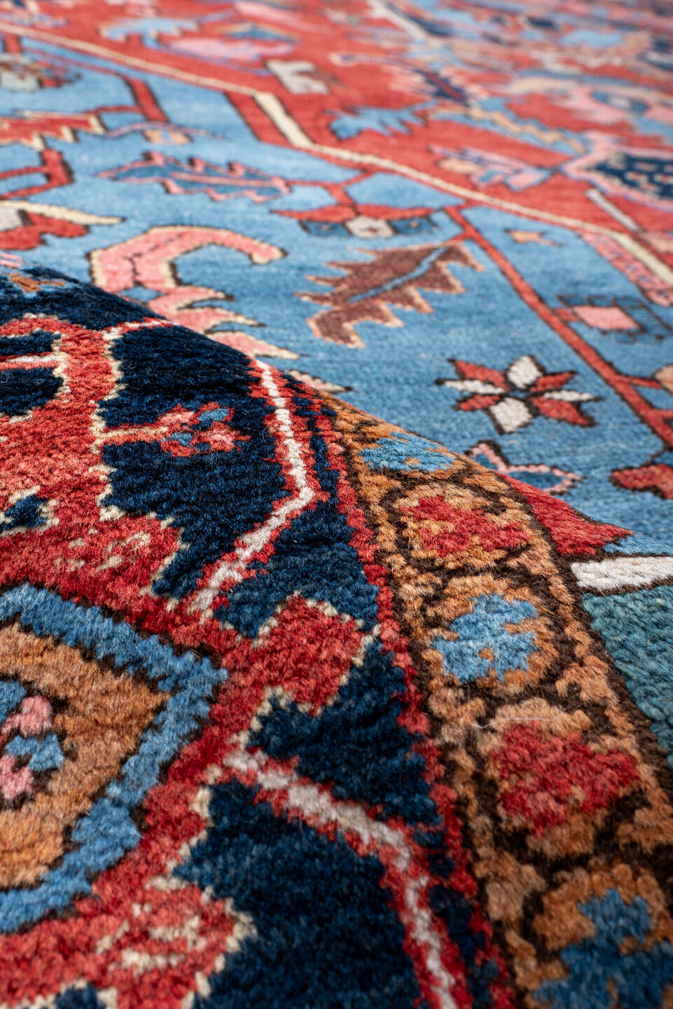 10' x 14' one-of-a-kind handmade antique Serapi large size rug. Color palette: rust, sky blue, navy, coral, ivory, slate