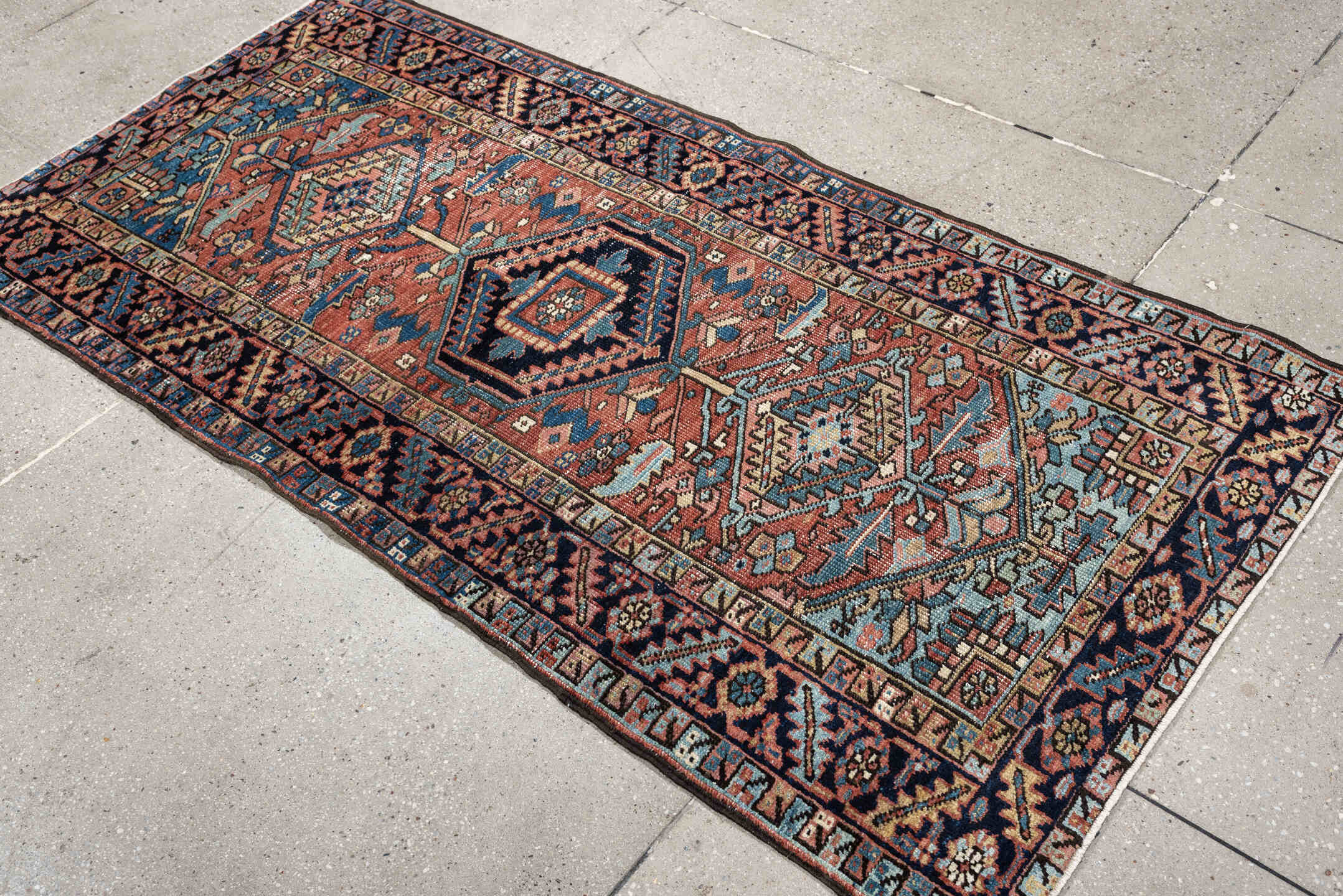 3' x 6' one-of-a-kind handmade antique Heriz small size rug. Color palette: terracotta, navy, sky blue, ivory, camel, rose