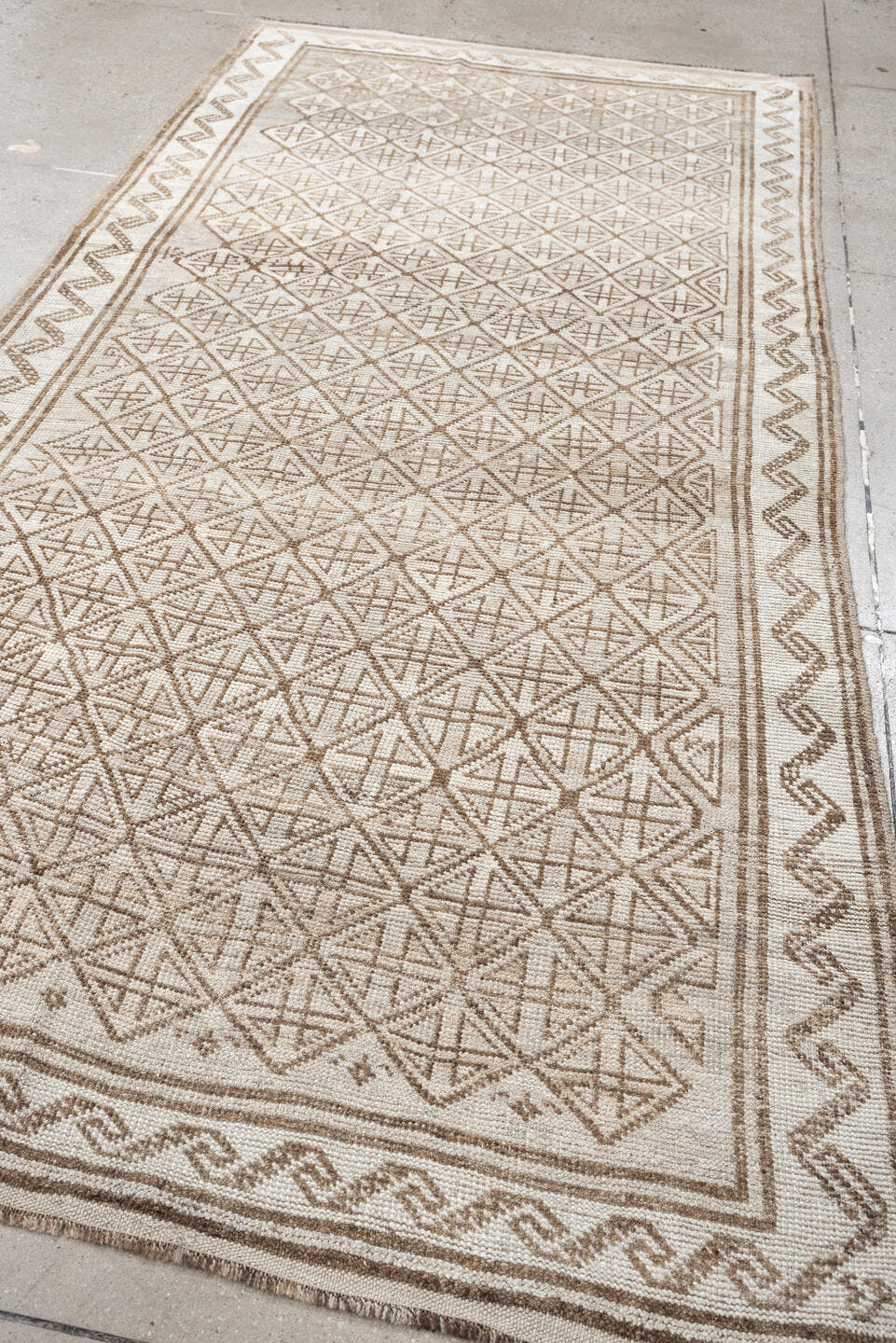 9' x 4' one-of-a-kind handmade antique Belouch rug. Color palette: ivory, camel, taupe, sand, light brown, beige, gray