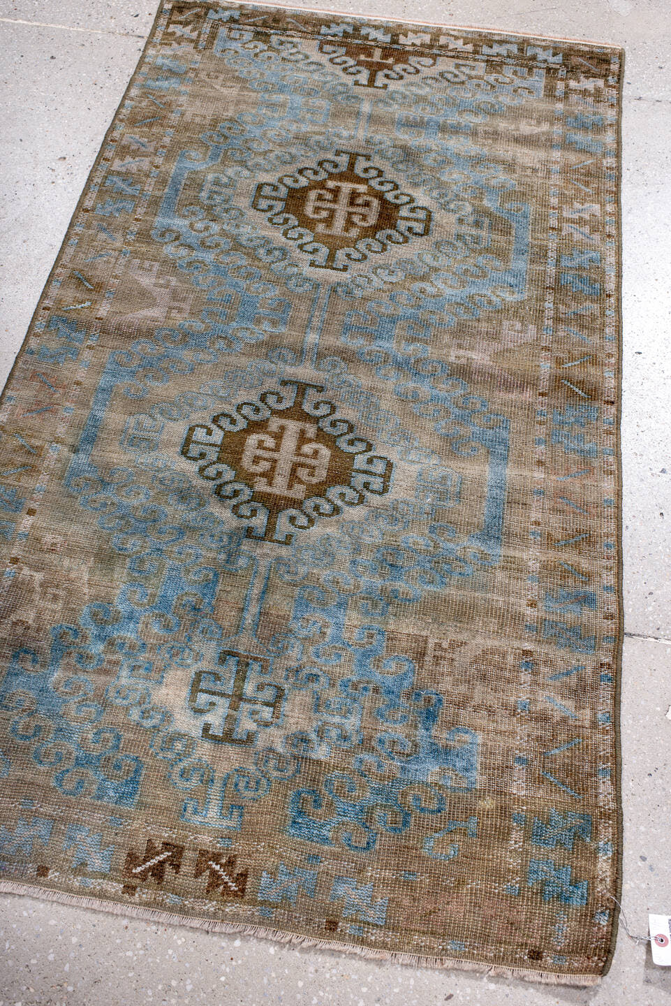 2' x 4' one-of-a-kind handmade antique Belouch small size rug. Color palette: camel, pale blue, taupe, ivory, brown, beige