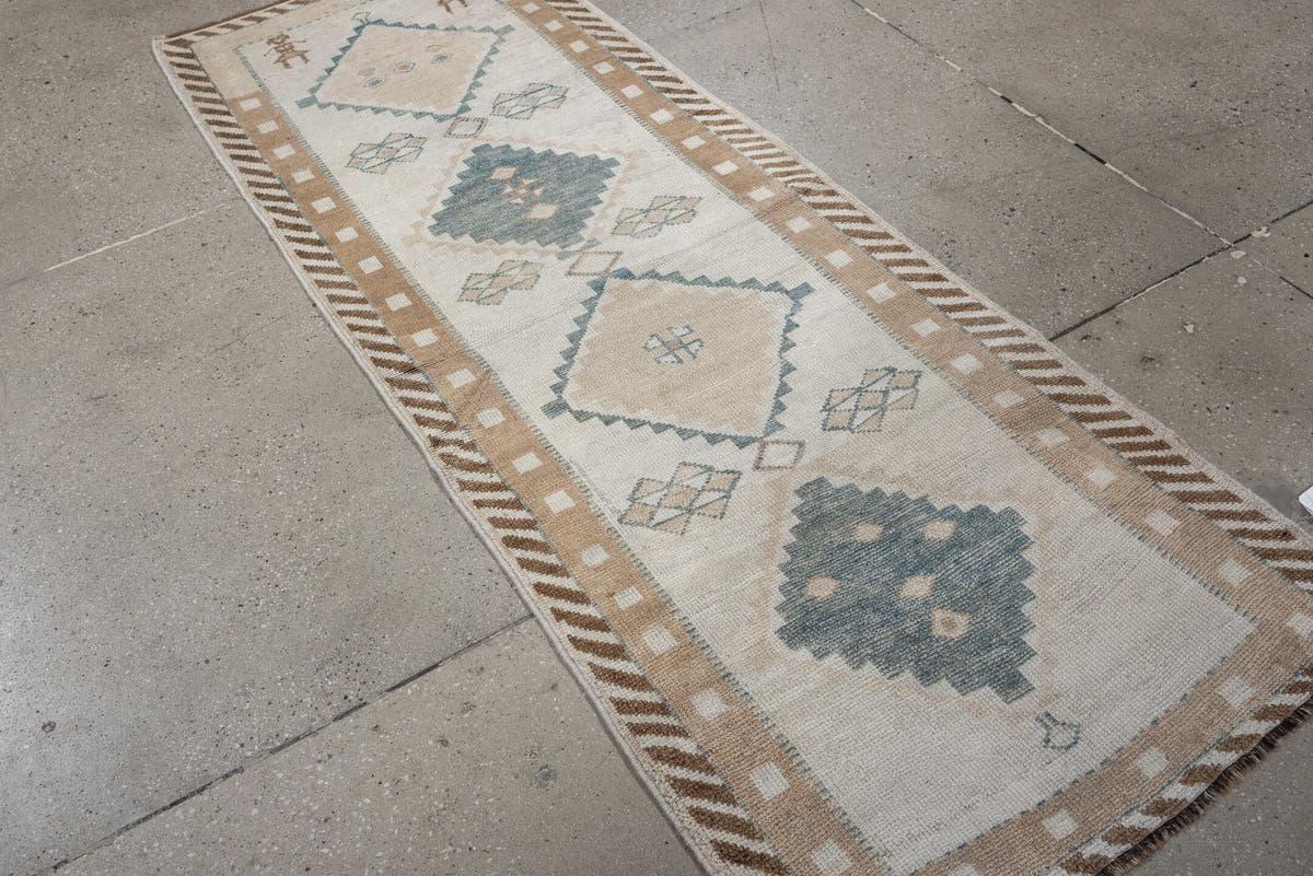 2' x 6' one-of-a-kind handmade antique Gabbeh runner rug. Color palette: ivory, pale blue, camel, taupe, brown, light blue
