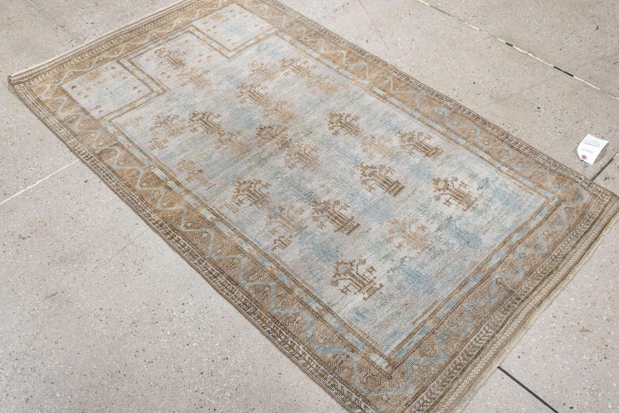 2' x 4' one-of-a-kind handmade antique Belouch small size rug. Color palette: ivory, camel, taupe, sky blue, beige