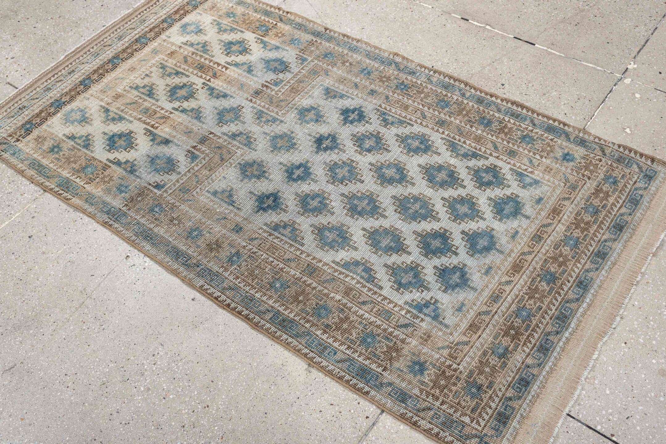 2' x 5' one-of-a-kind handmade antique Belouch small size rug. Color palette: ivory, sky blue, taupe, camel, beige