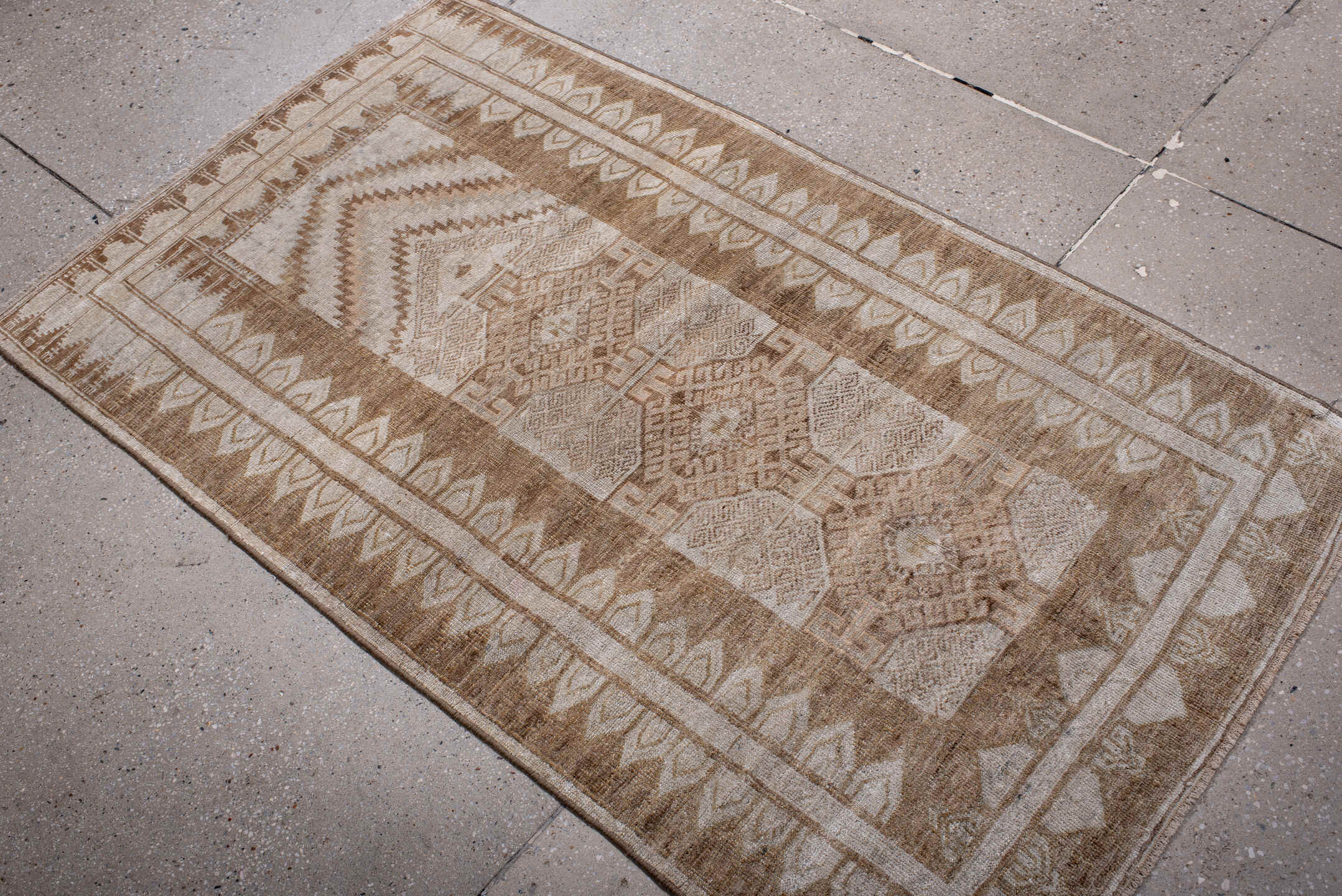 3' x 5' one-of-a-kind handmade antique Belouch small size rug. Color palette: ivory, camel, taupe, beige, sand, gray