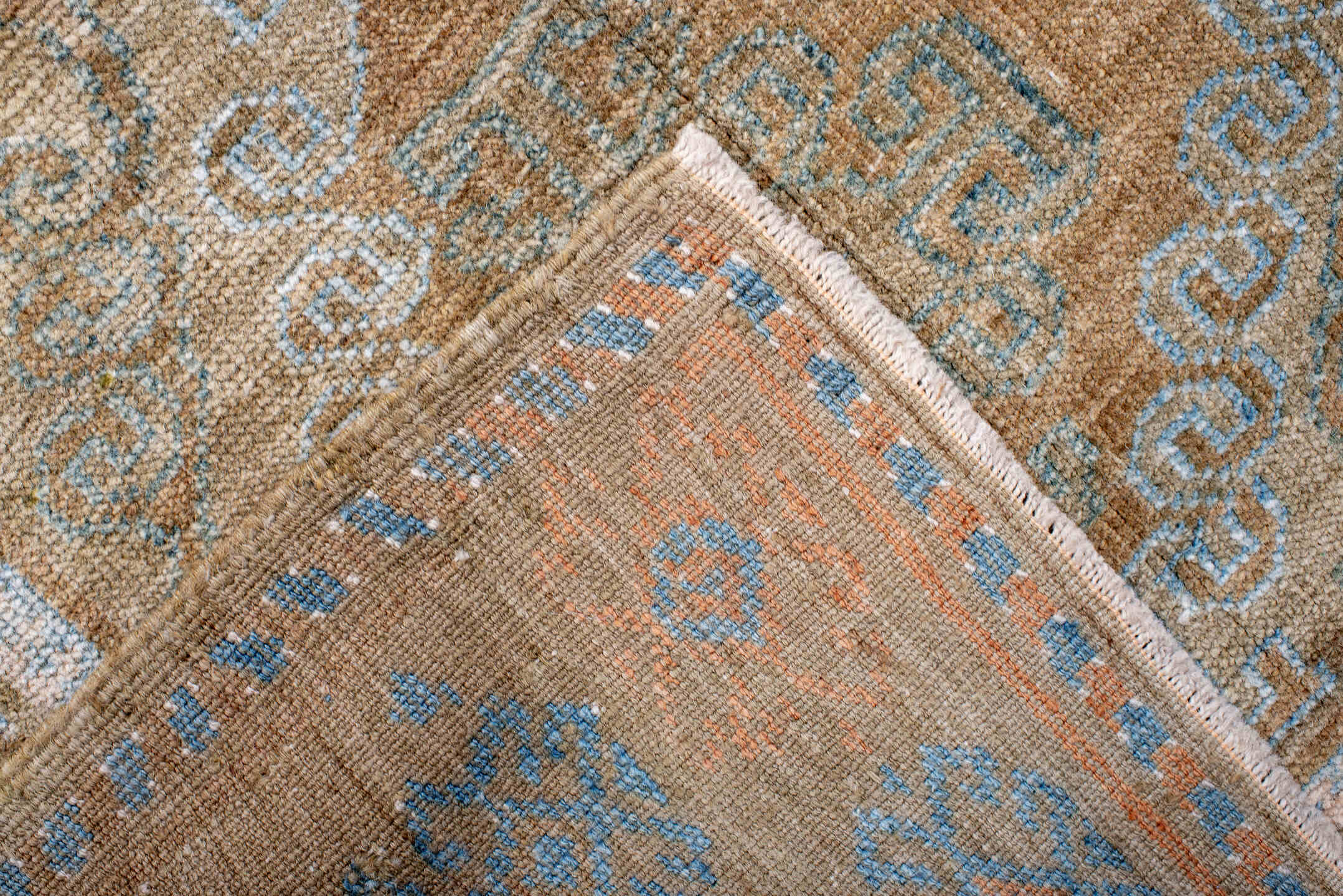 3' x 4' one-of-a-kind handmade antique Belouch small size rug. Color palette: taupe, camel, sky_blue, ivory, terra_cotta