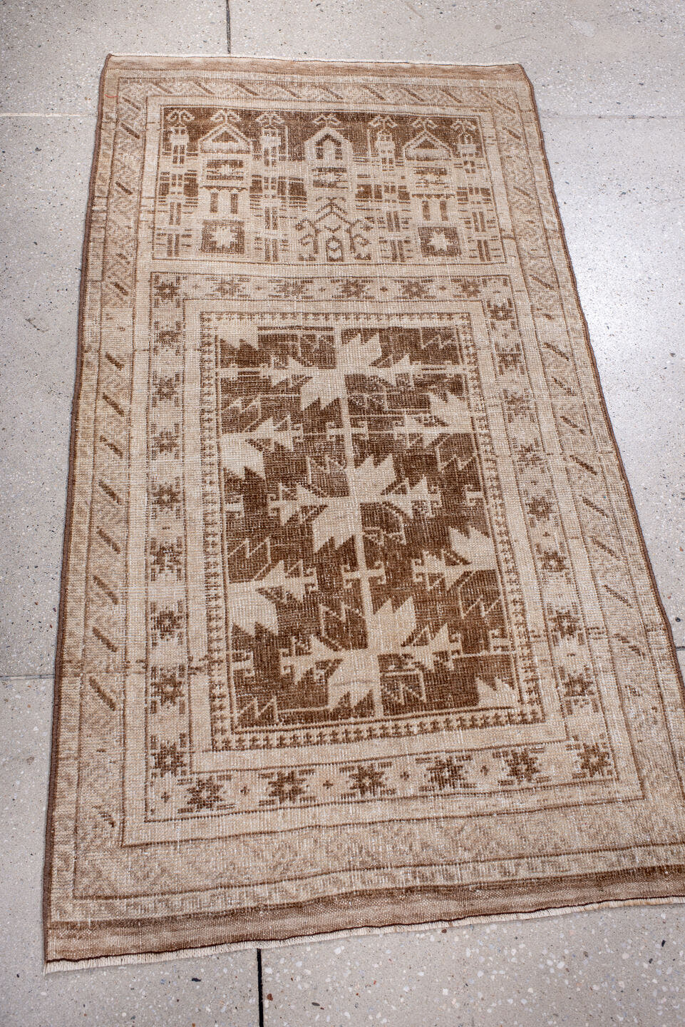 2' x 4' one-of-a-kind handmade antique Belouch small size rug. Color palette: ivory, taupe, camel, brown, beige, gray