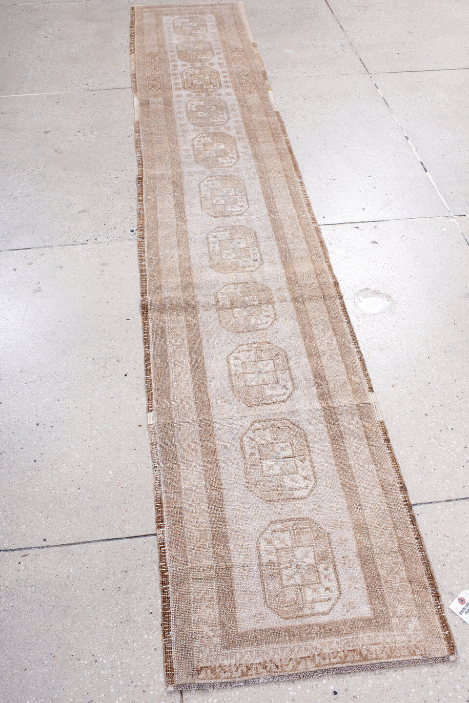 1' x 9' one-of-a-kind handmade antique Afghan rug. Color palette: ivory, taupe, beige, camel, sand, gray