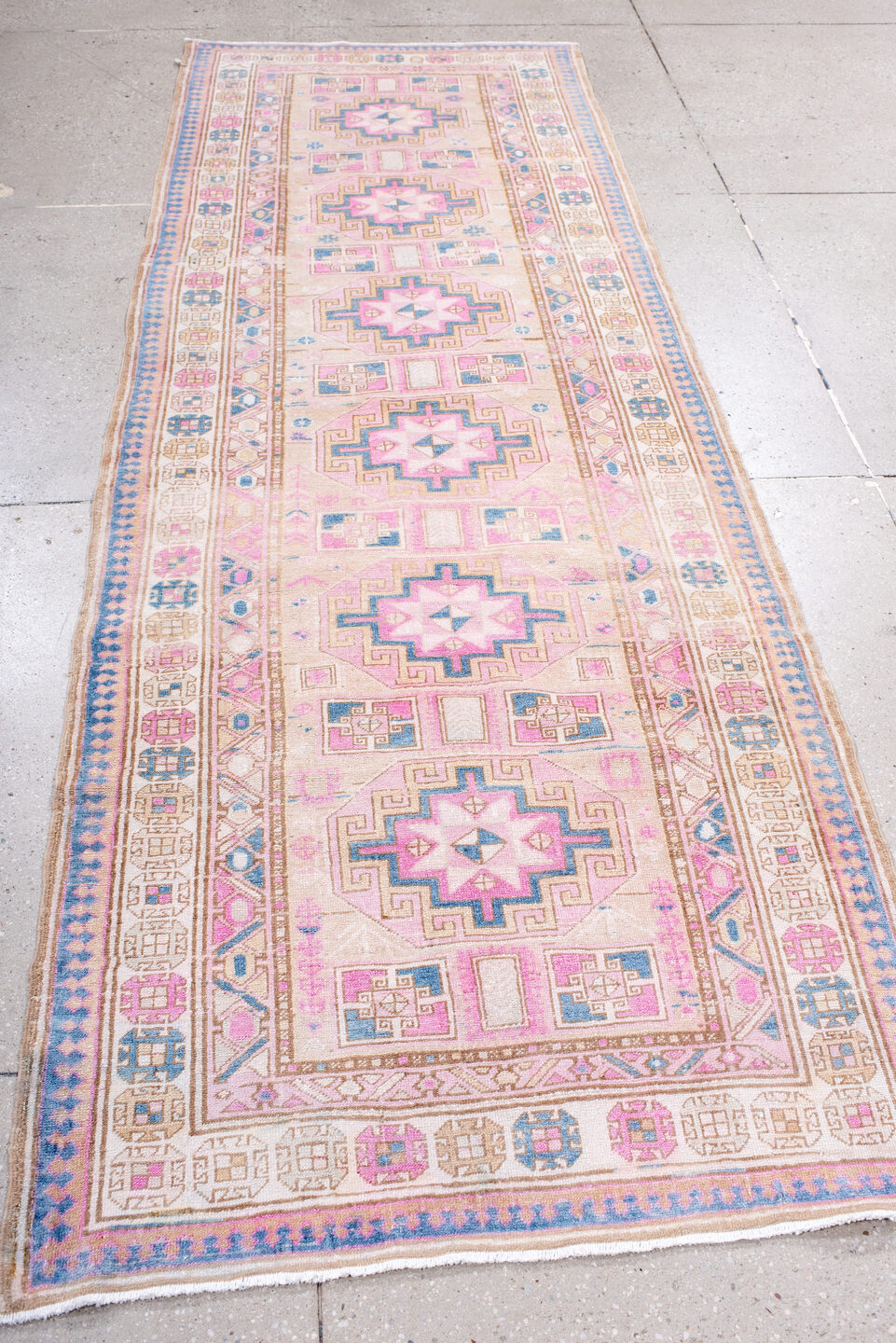 3' x 9' one-of-a-kind handmade antique Sarab runner rug. Color palette: ivory, blush, sky blue, camel, taupe, rose, pink