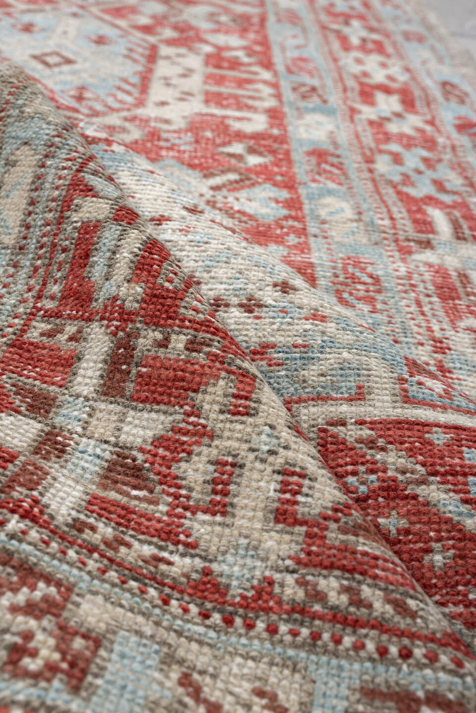 3' x 10' one-of-a-kind handmade vintage Heriz runner rug. Color palette: pale blue, terracotta, ivory, brick red, taupe