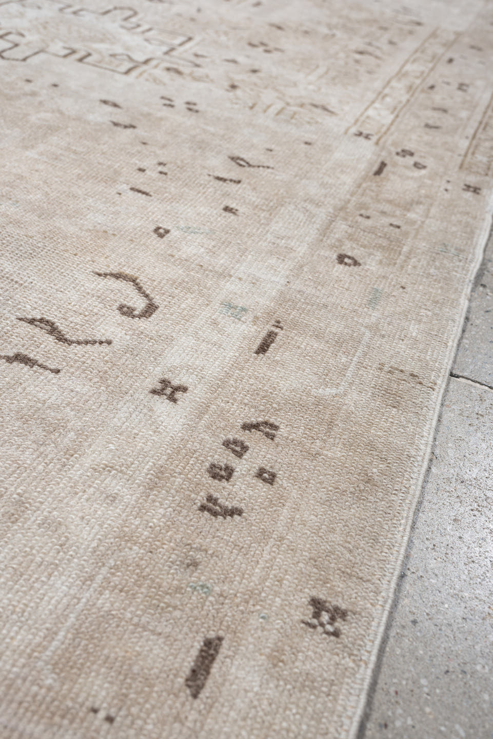 6' x 3' one-of-a-kind handmade vintage Karaje rug. Color palette: ivory, taupe, beige, camel, brown, gray